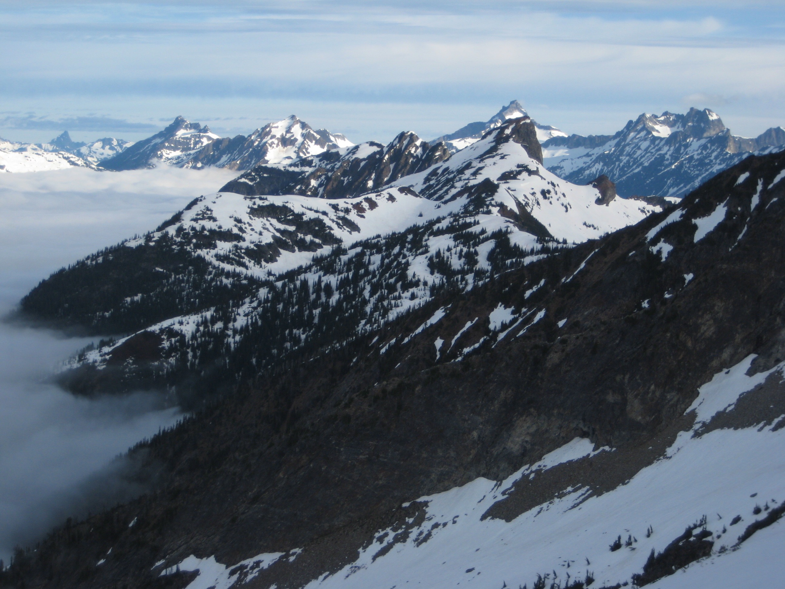 distant view of the American Chilliwack Mountains as seen from mountain climbers camp on the ridge of Mt Prophet in North Cascades National Park