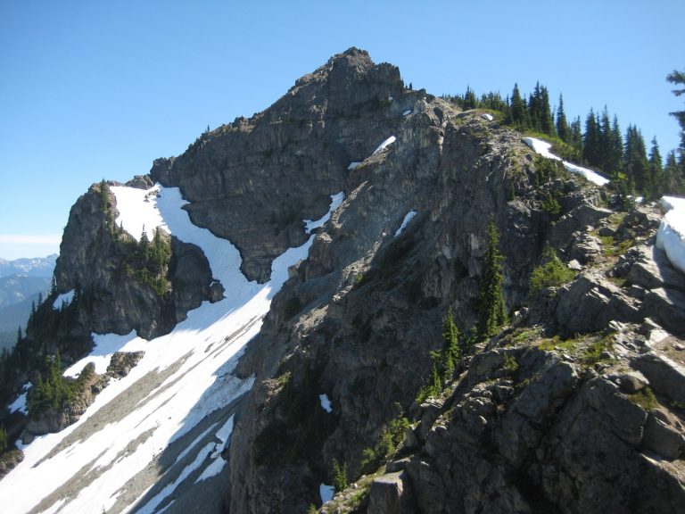 Looking up at triangular rocky summit of Dewey Peak