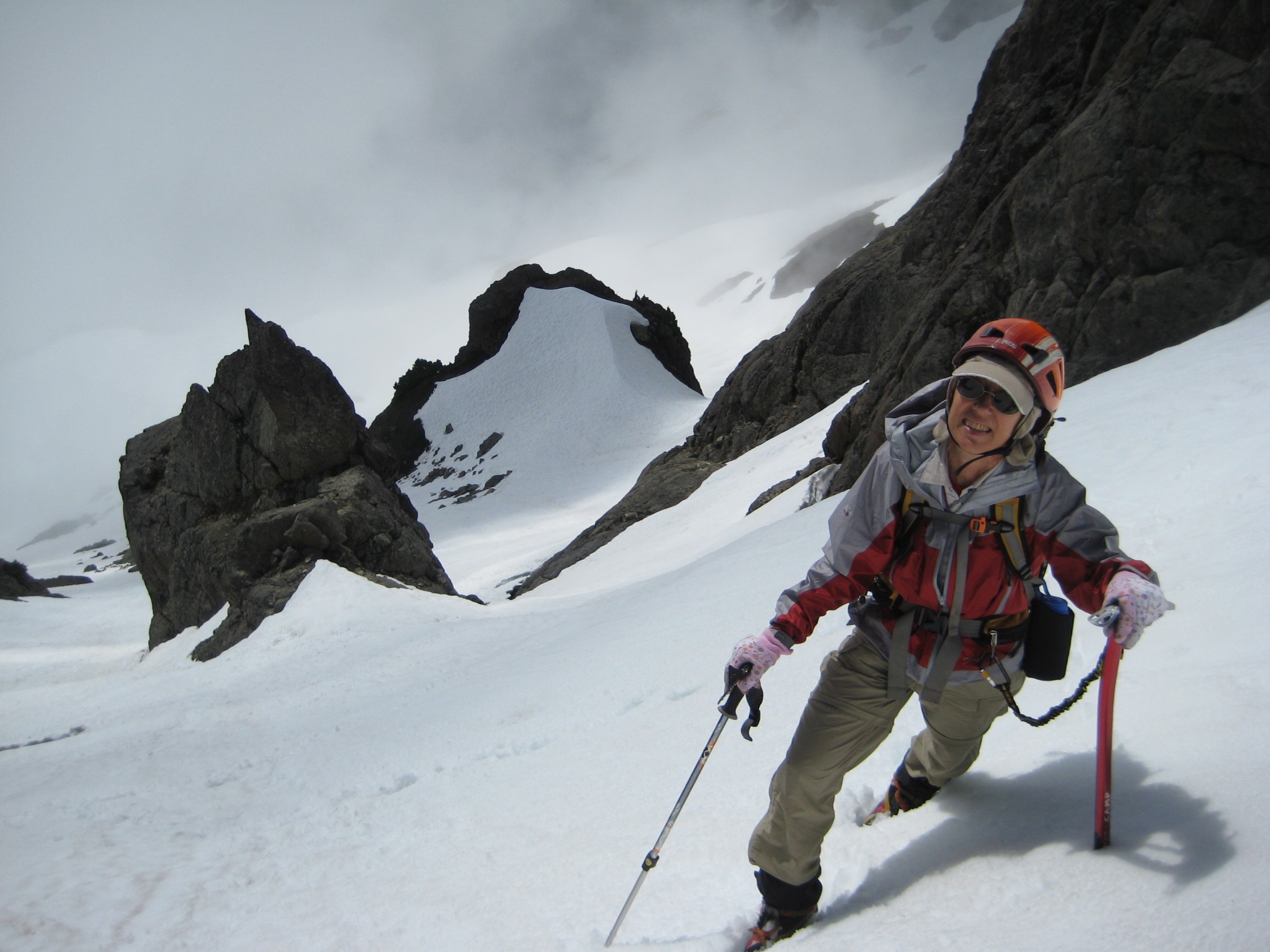 climber reaching the upper couloir with snow slopes below