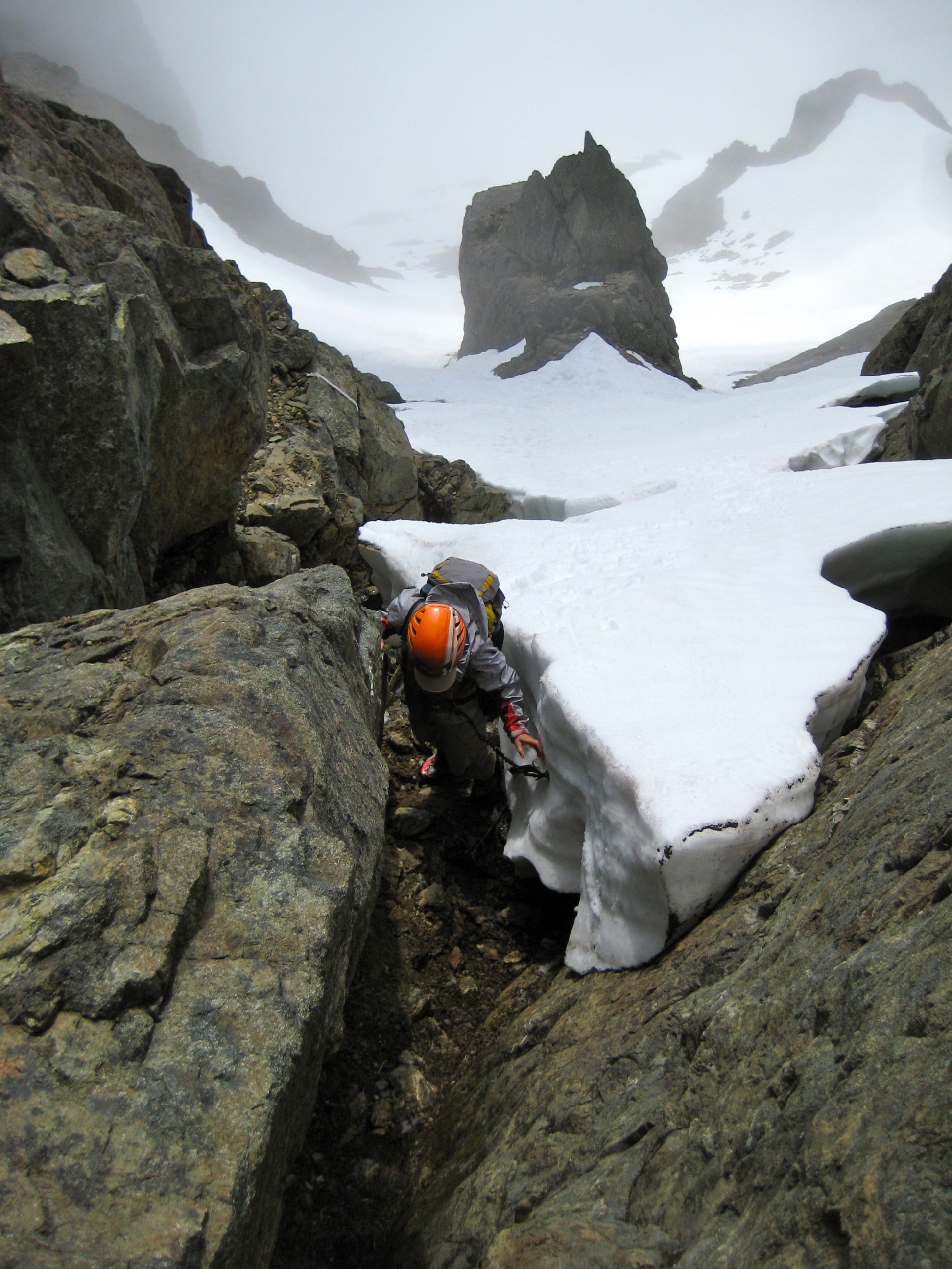 looking down the steep snowfinger near the summit of North Brother in the Olympic Mountains