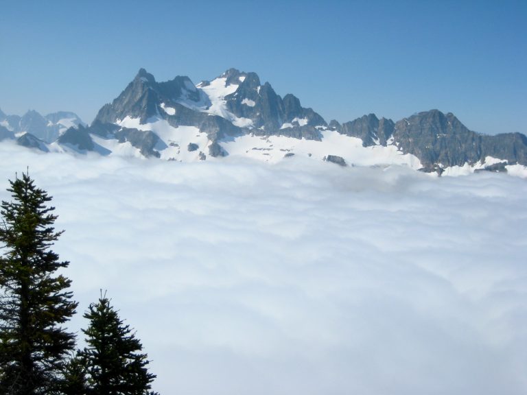 Mt Logan stands above the clouds as seen from Red Mountain in North Cascades National Park
