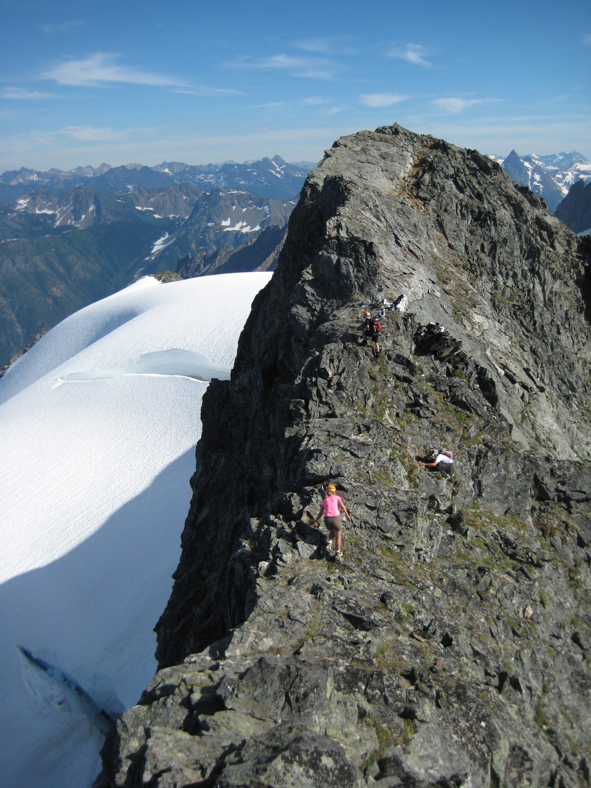 mountain climber on the rocky ridge of Hurry-Up Peak at the start of the Ptarmingan Traverse
