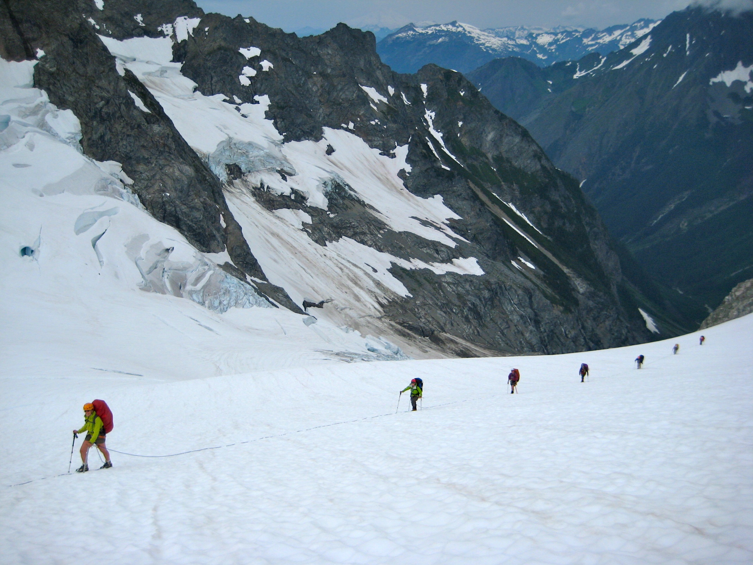roped mountain climbers traversing the Middle Cascade Glacier on the Ptarmigan Traverse