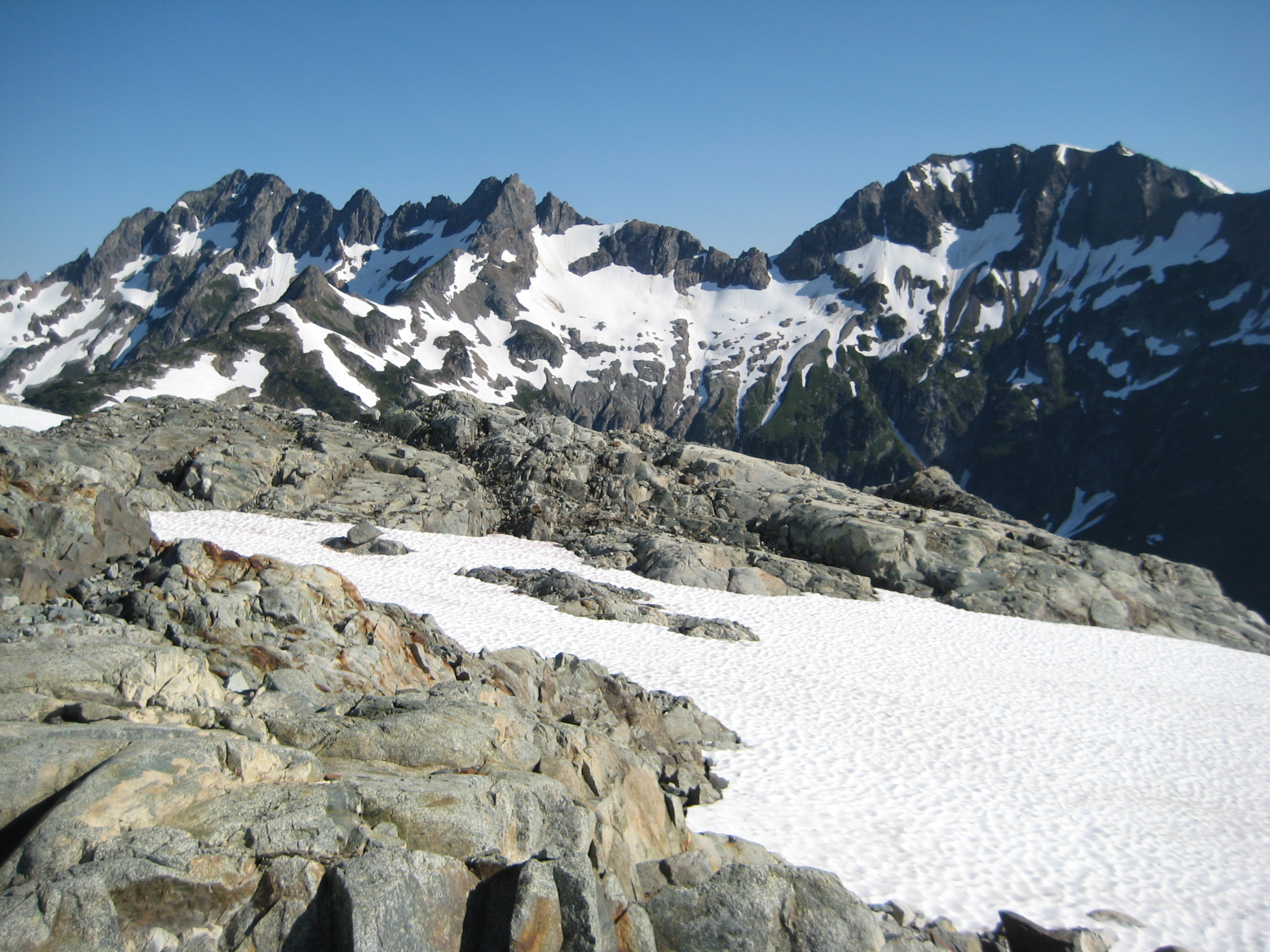 Mt Formidable and Spider Mountain with LeConte Pass and linguring snow fields on the Ptarmigan Traverse