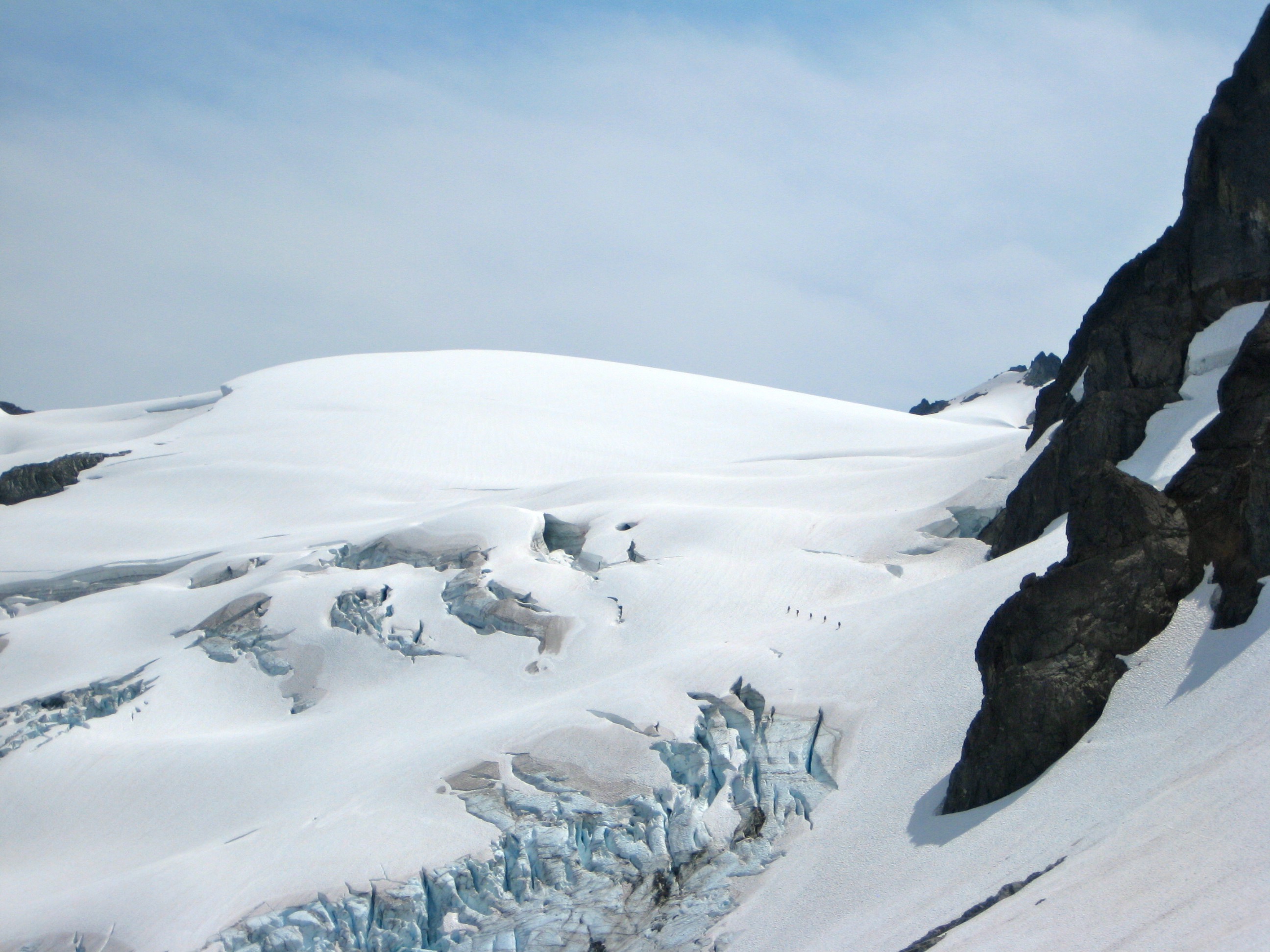 roped mountain climbers crossing the large LeConte Glacier on the Ptarmigan Traverse