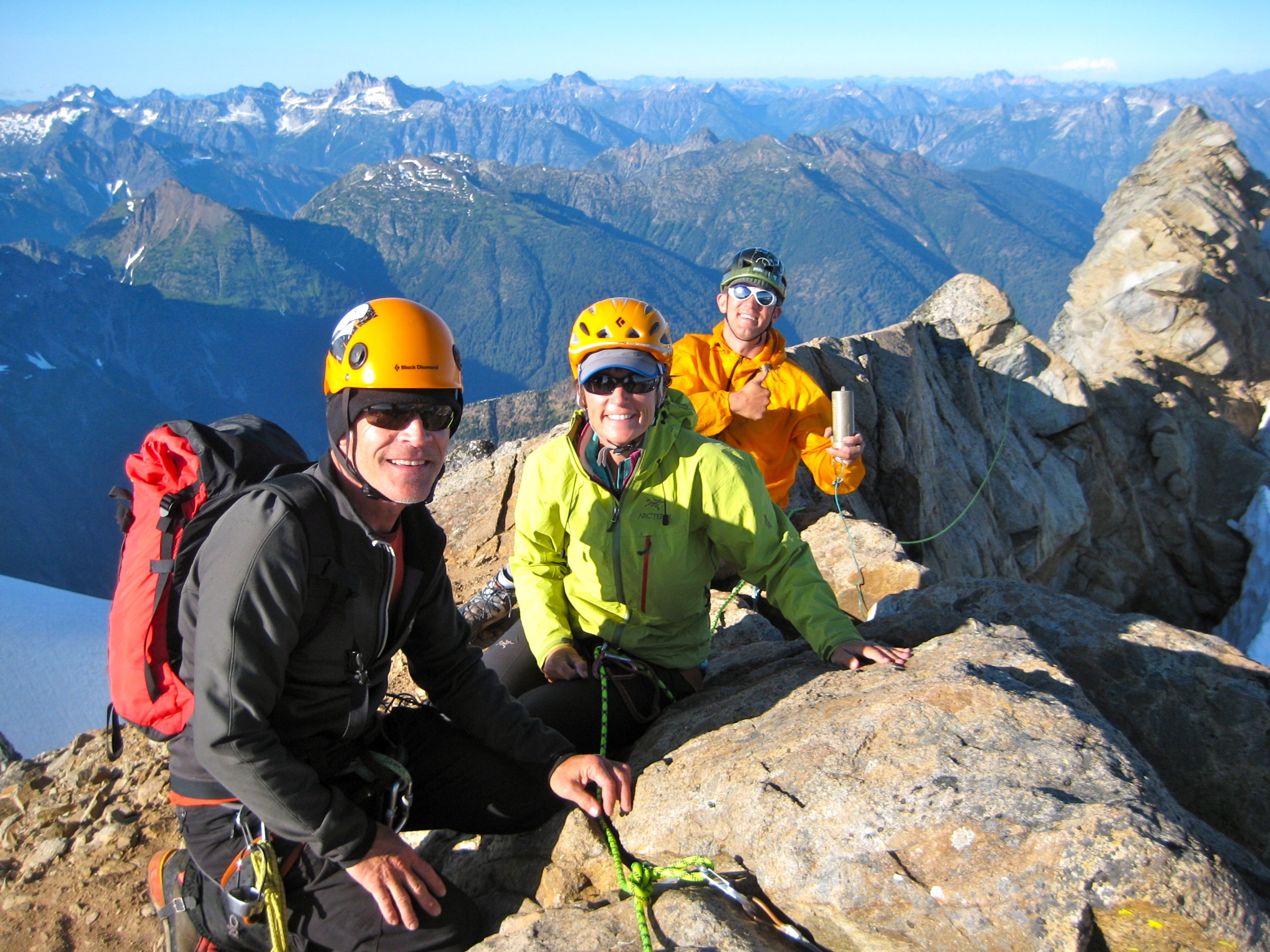 mountain climbers on the rocky summit of Dome Peak in the Glacier Peak Wilderness