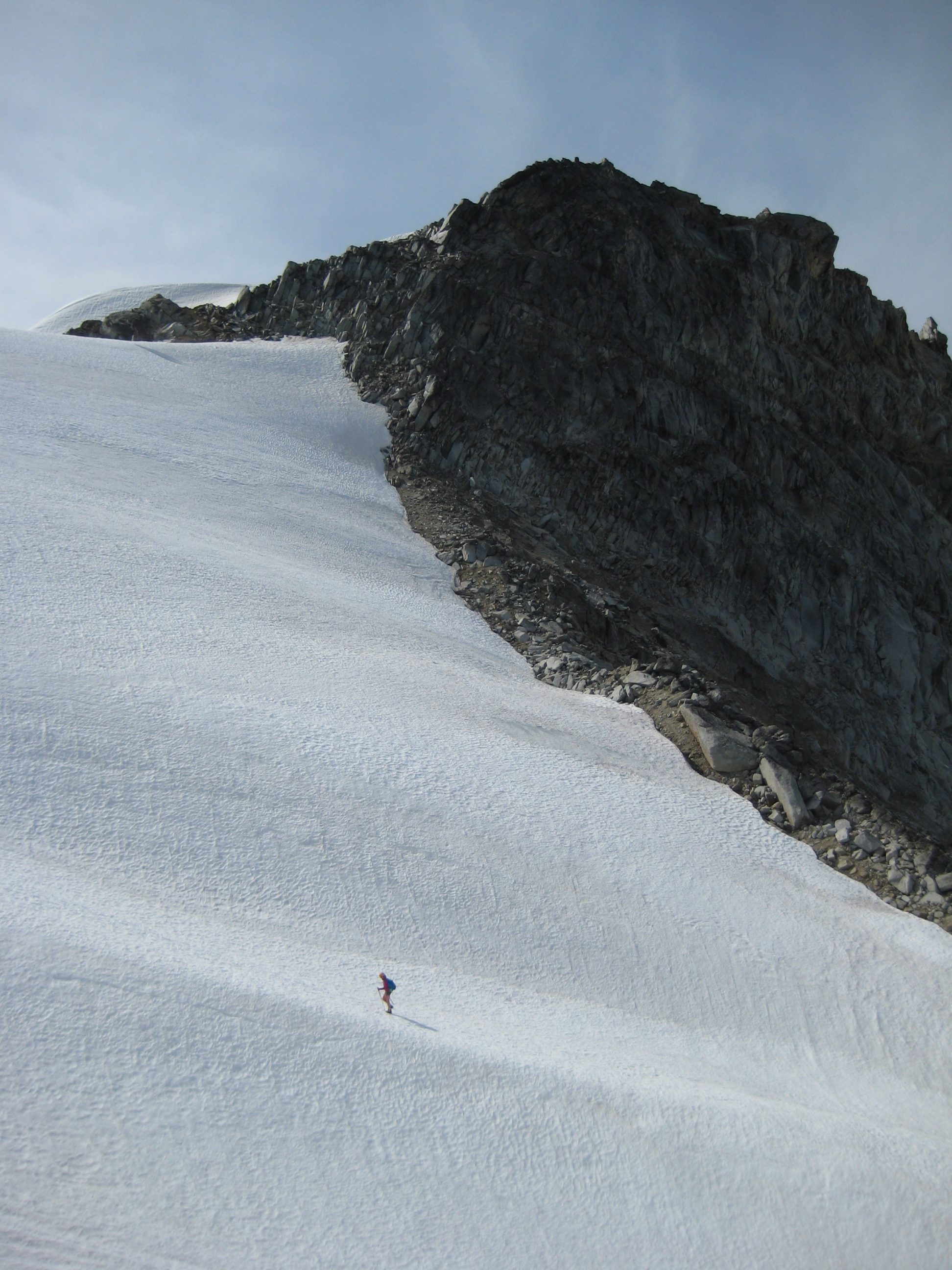 mountain climber ascending the Dome Glacier in the Glacier Peak Wilderness