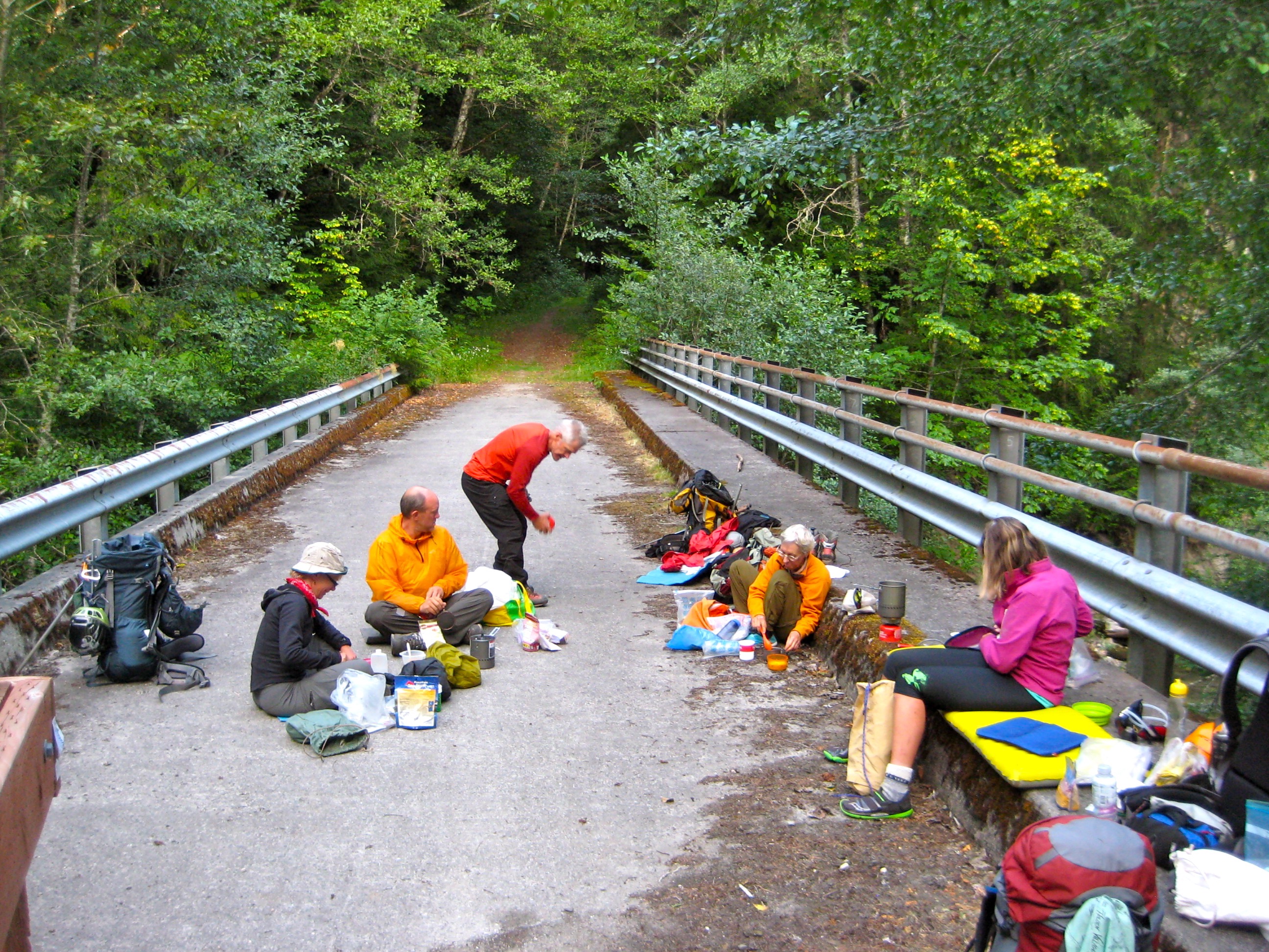 mountain climbers having dinner on the Downey Creek bridge
