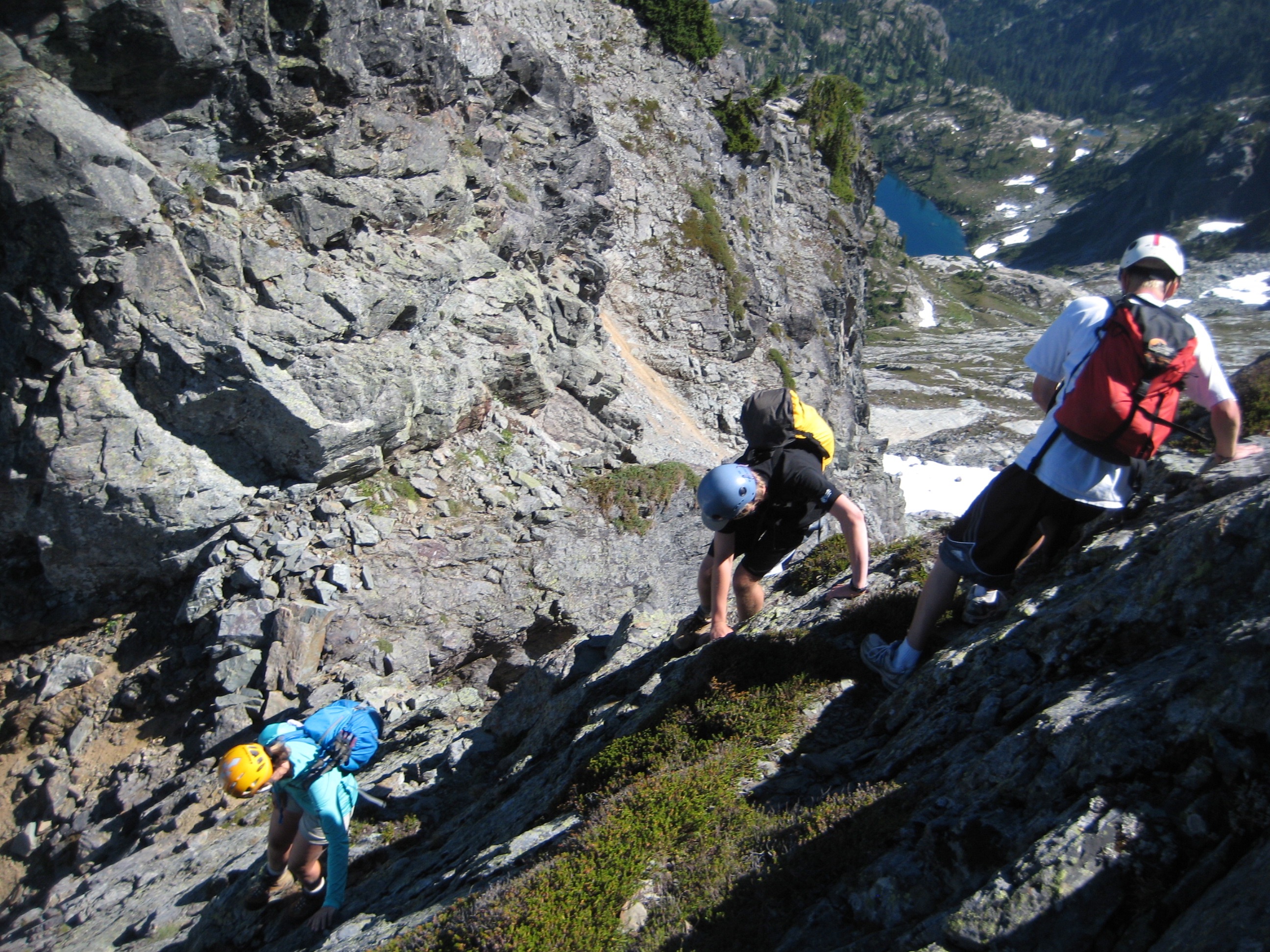 climbers scrambling down the east ridge of Chikamin Peak in the Alpine Lakes Wilderness