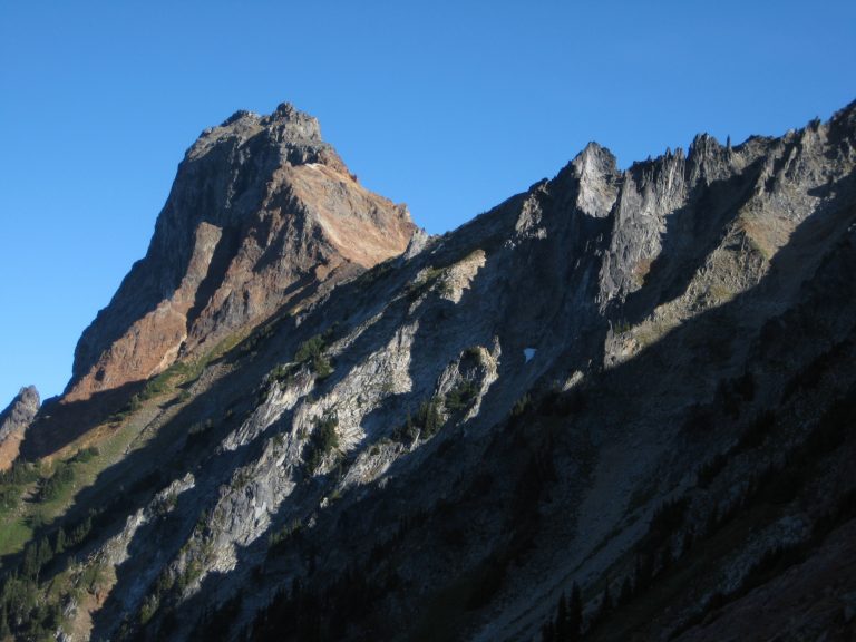 American Border Peak summit horn rises above a rocky ridge in the Mt Baker Wilderness