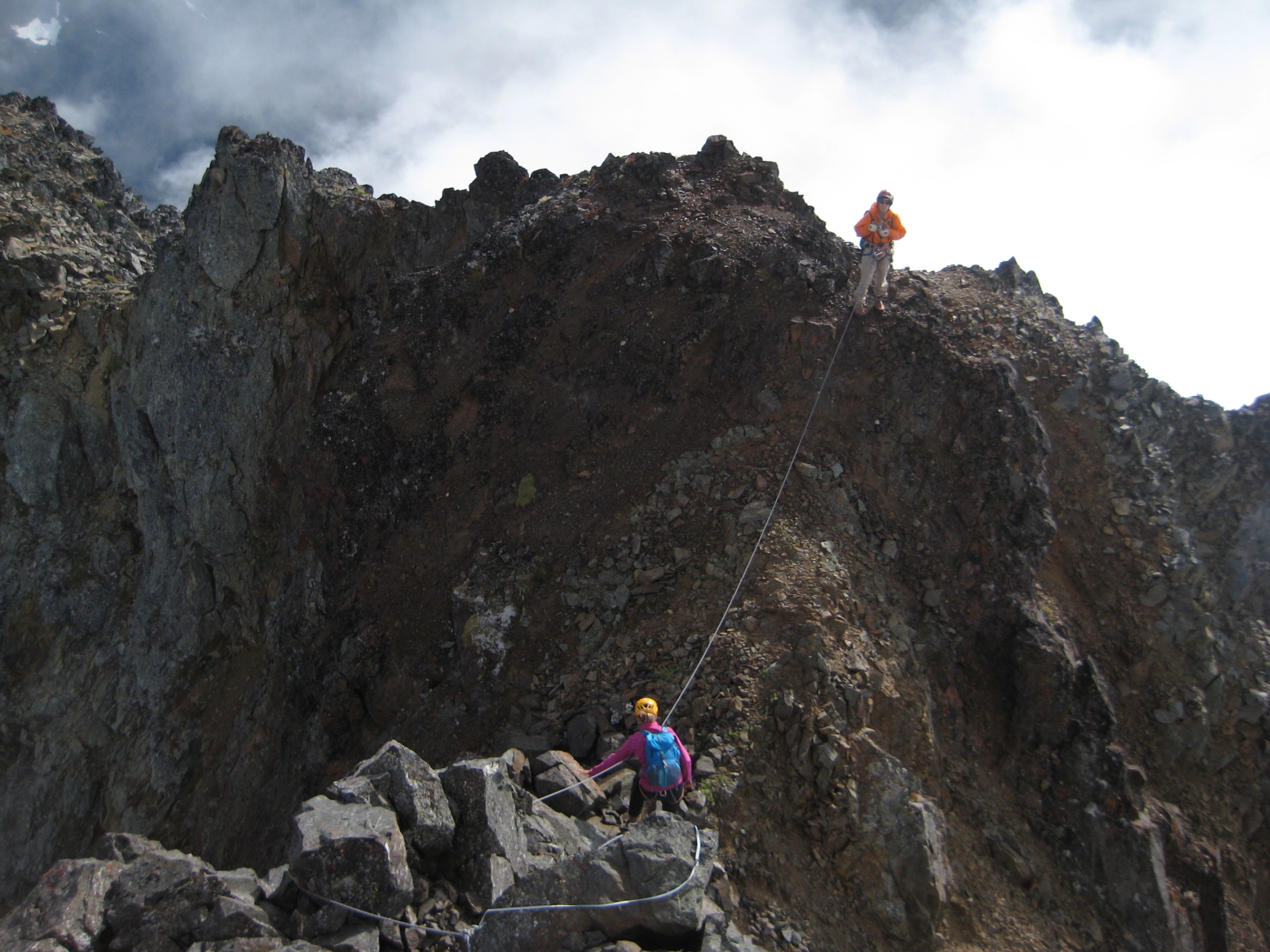 mountain climbers roped on the American Border Peak exposed summit ridge