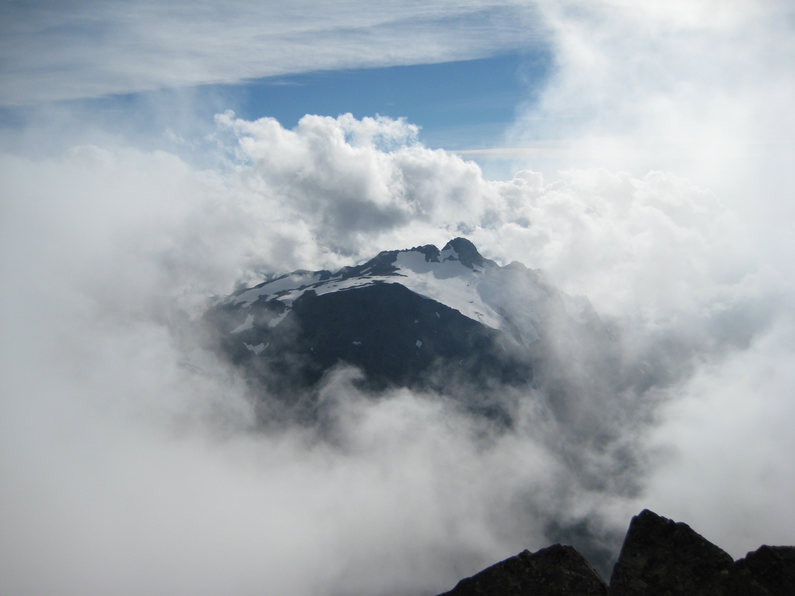 Tomyhoi Peak Thru Cloud Window exposes snow patches