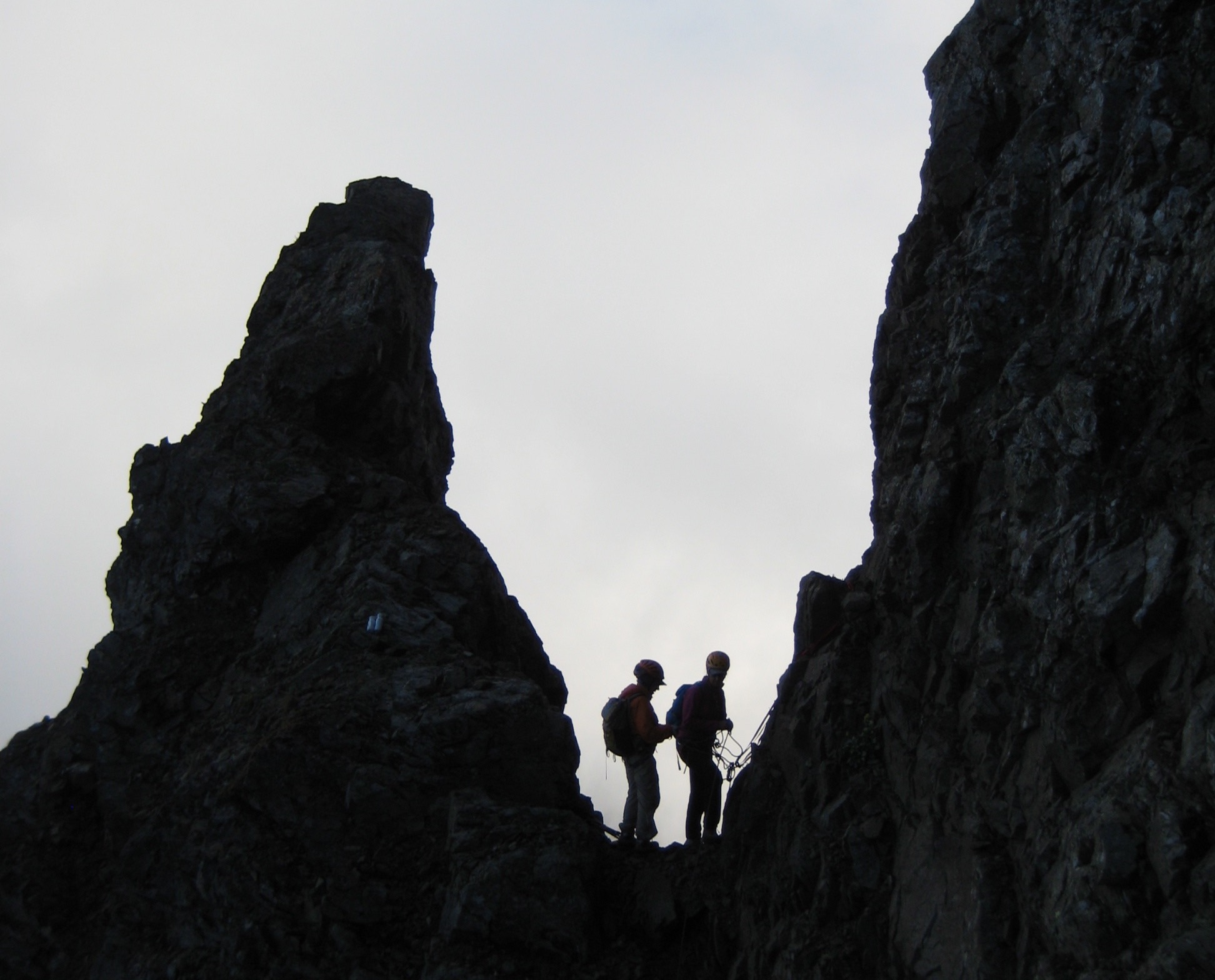 mountain climbers in the southeast notch of American Border Peak in the shade