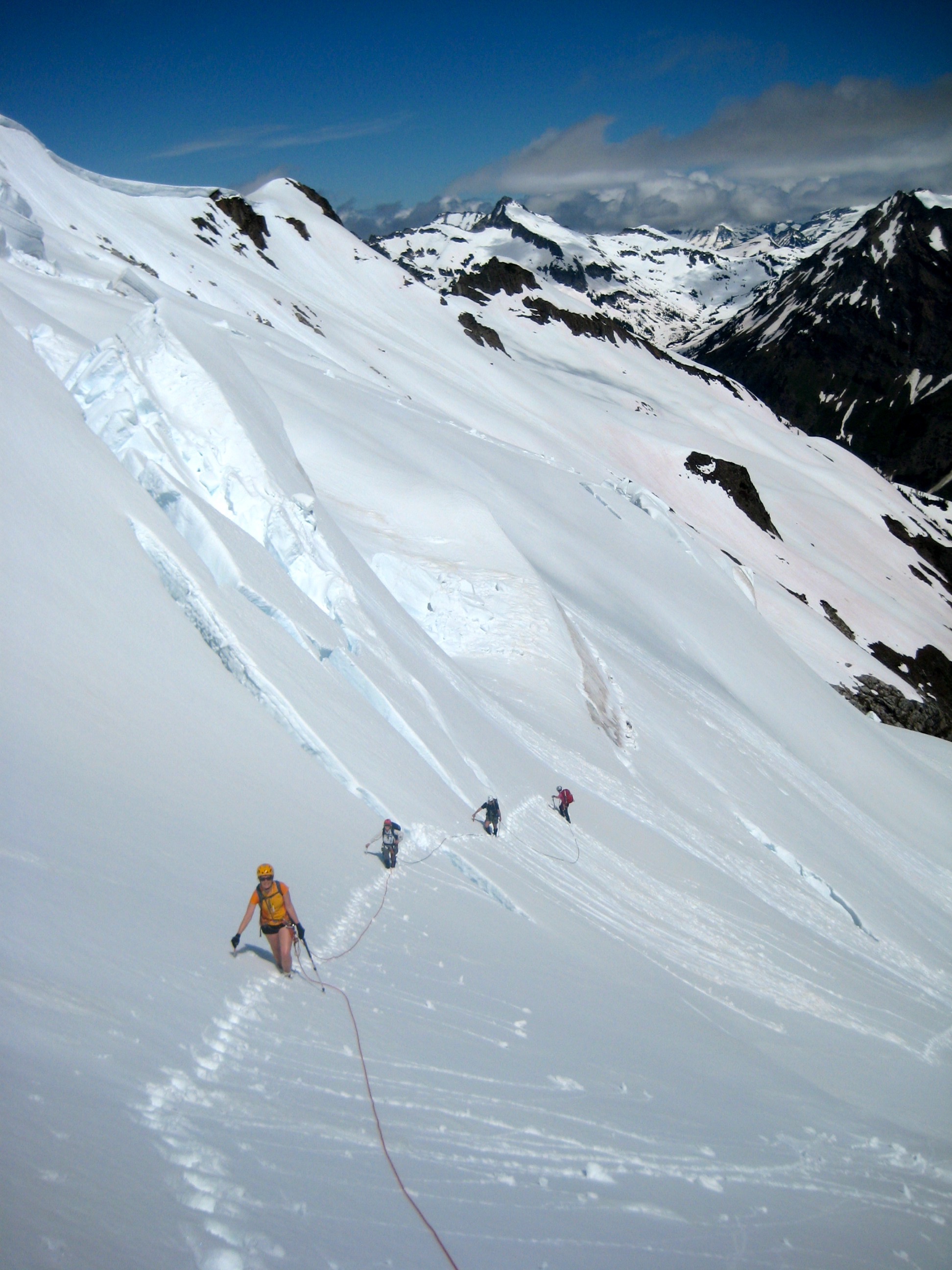roped mountain climbers ascending Lower Walrus Glacier in the DaKobed Range in the Glacier Peak WIlderness