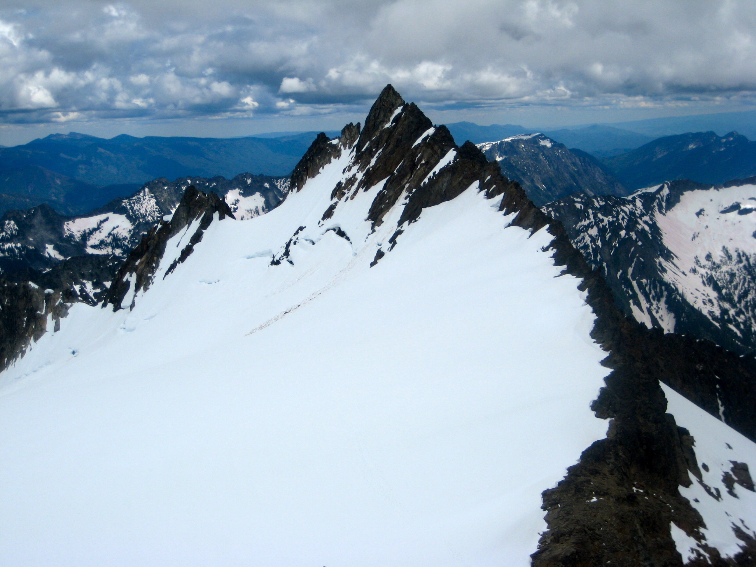 Souteast Peak of Clark Mountain and Upper Walrus Glacier with high clouds in the DaKobed Range