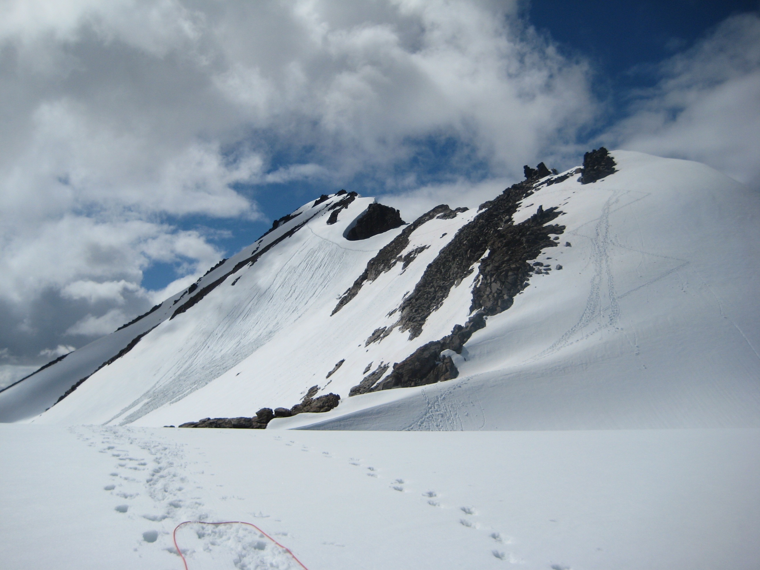 mountain climbers tracks in the snow leading to the summit of Clark Mountain in the Glacier Peak WIlderness