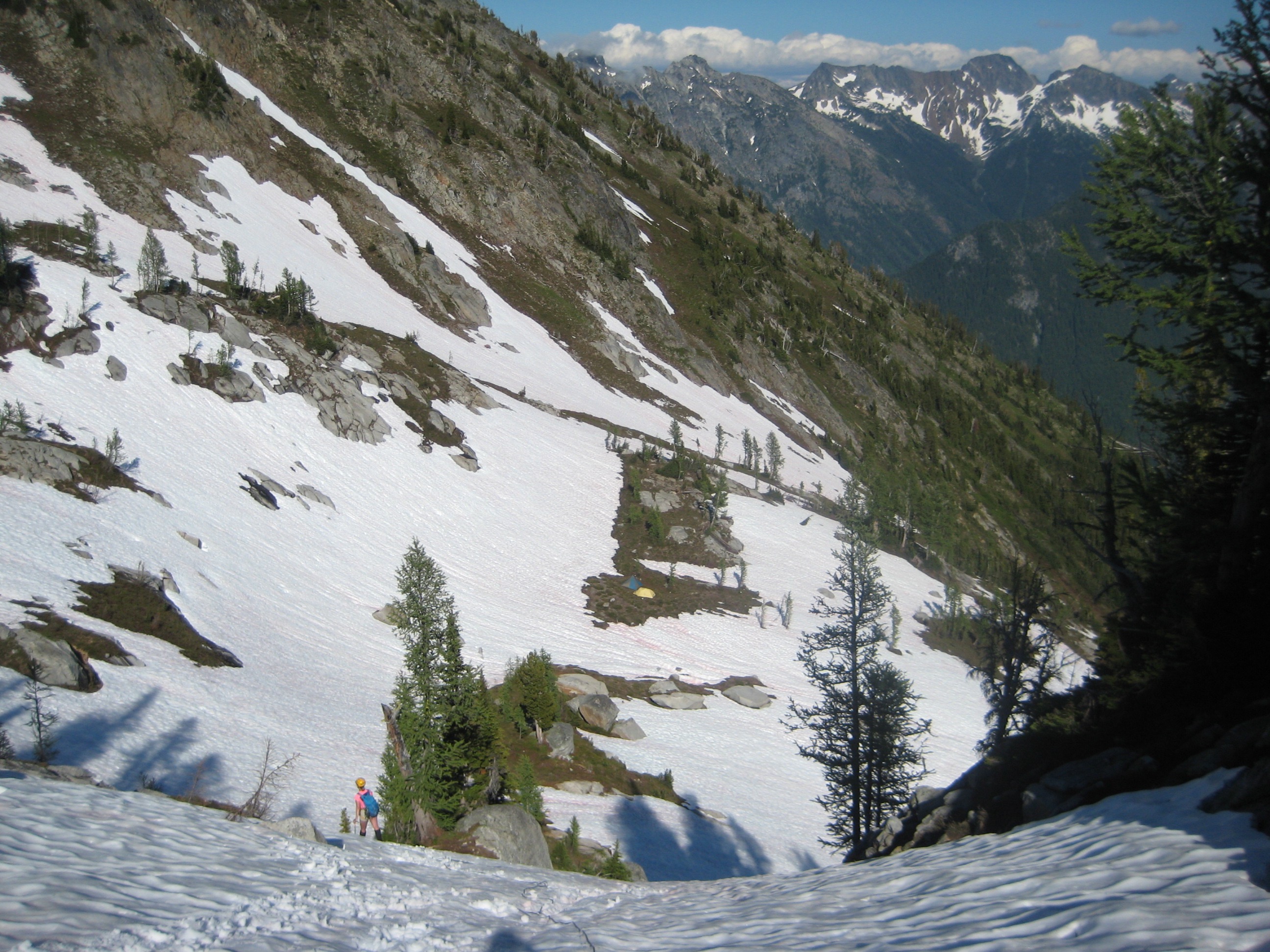 looking down on mountain climber's camp in snow covered Upper Blue Basin near Agnes Peak in the Glacier Peak WIlderness