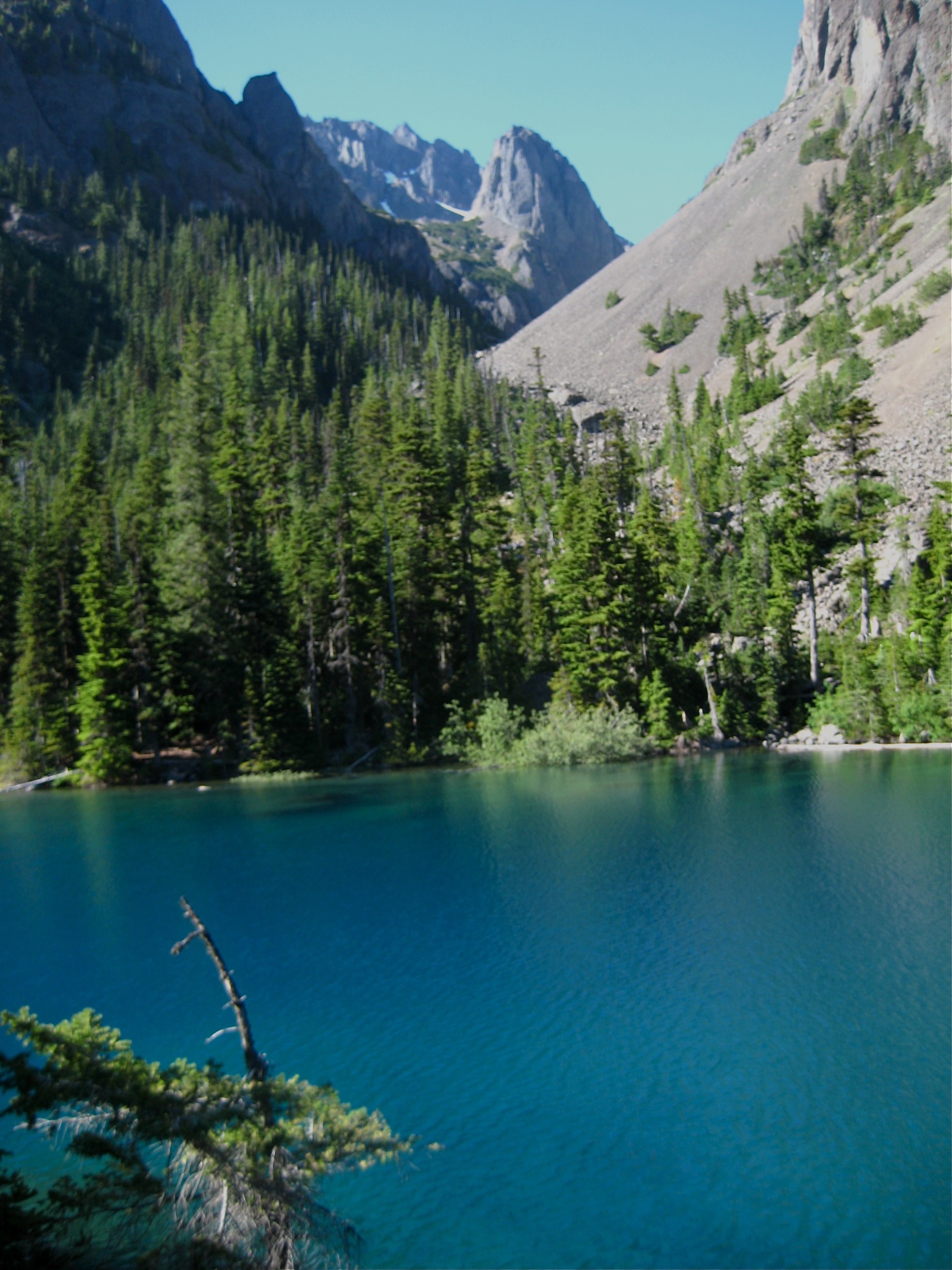Inner Constance Peak rises up behind Lake Constance with exposed scree slopes in the Olympic Mountains 