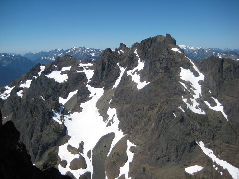 Snow patches cover the side of Mt Constance Inner Peak in the Olympic Mountains