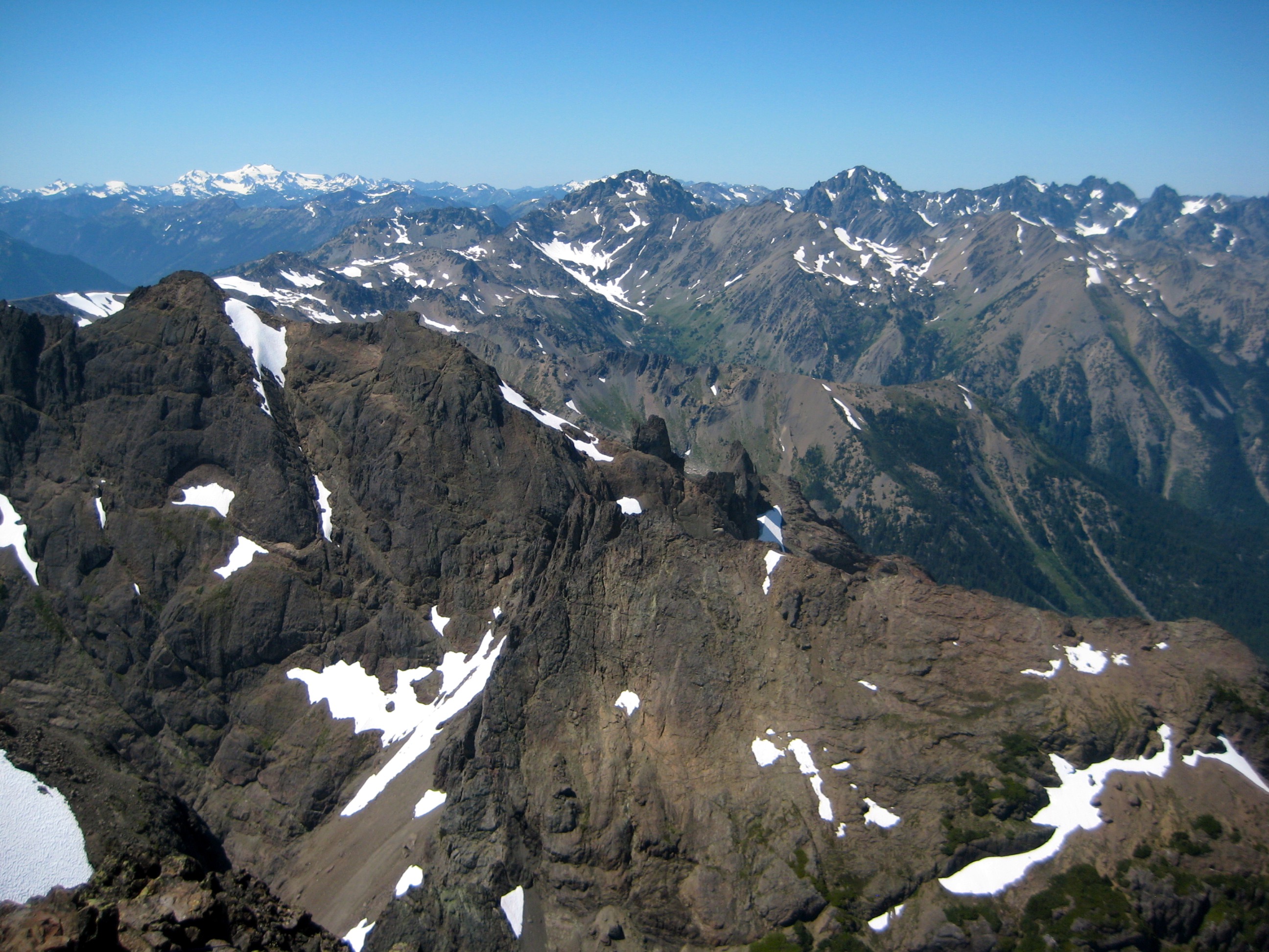 Distant view of the Olympic Mountains with the rocky ridge of Mt Constance