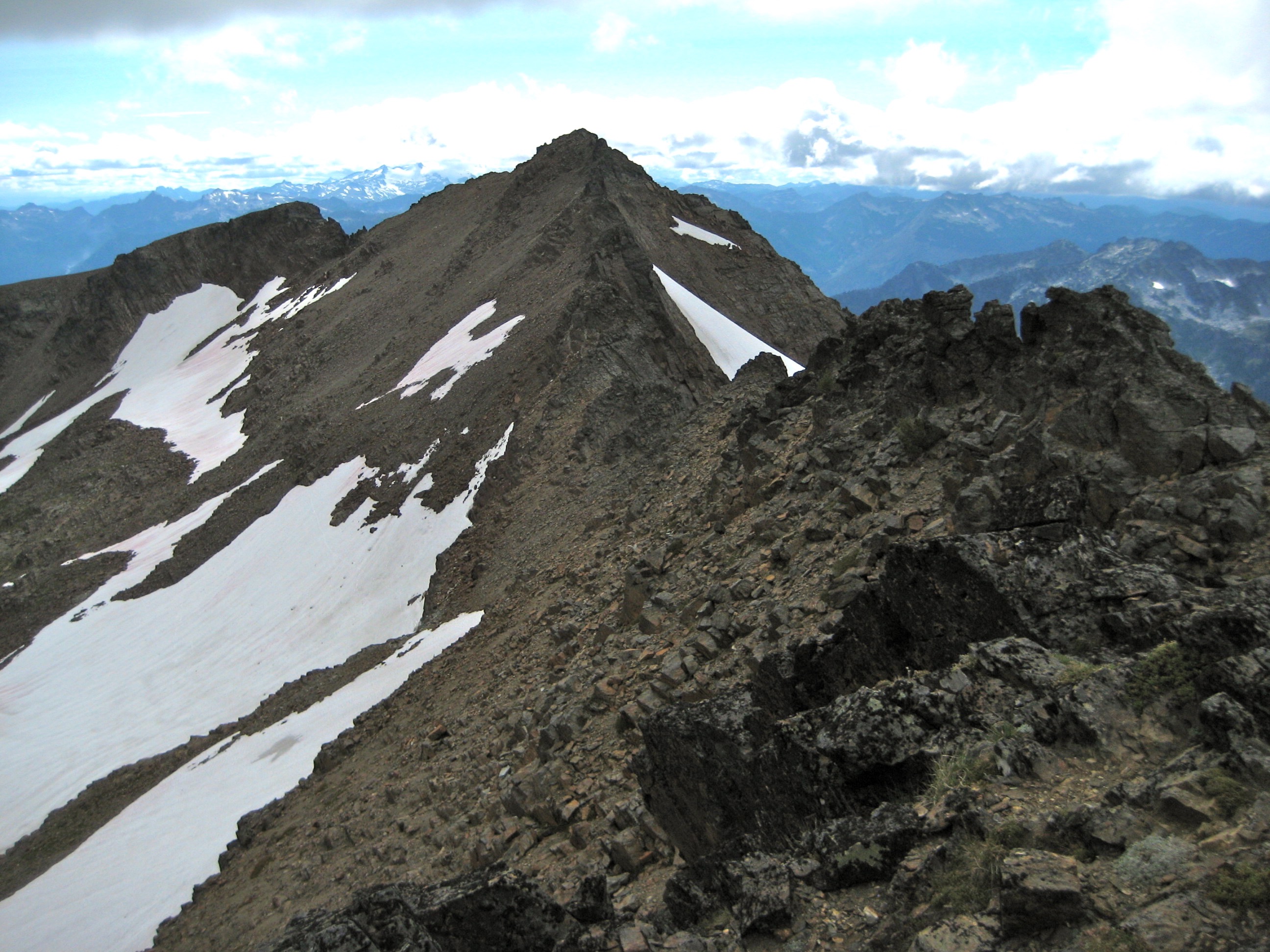 A rocky ridge leads out to the summit of Snowgrass Mountain in the Chiwaukum Mountains