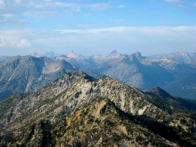 Methow Mountains in the distance with the Stehekin Mountains in the foreground as seen from Bowan Mountain summit