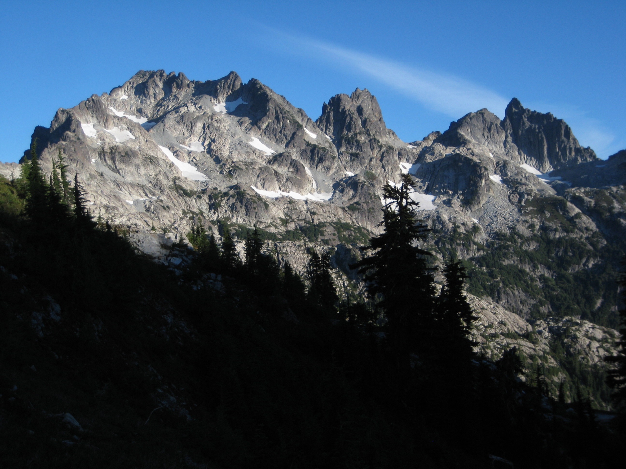 Morning sun lights up the gray face of Summit Chief Mountain in the Alpine Lakes WIlderness
