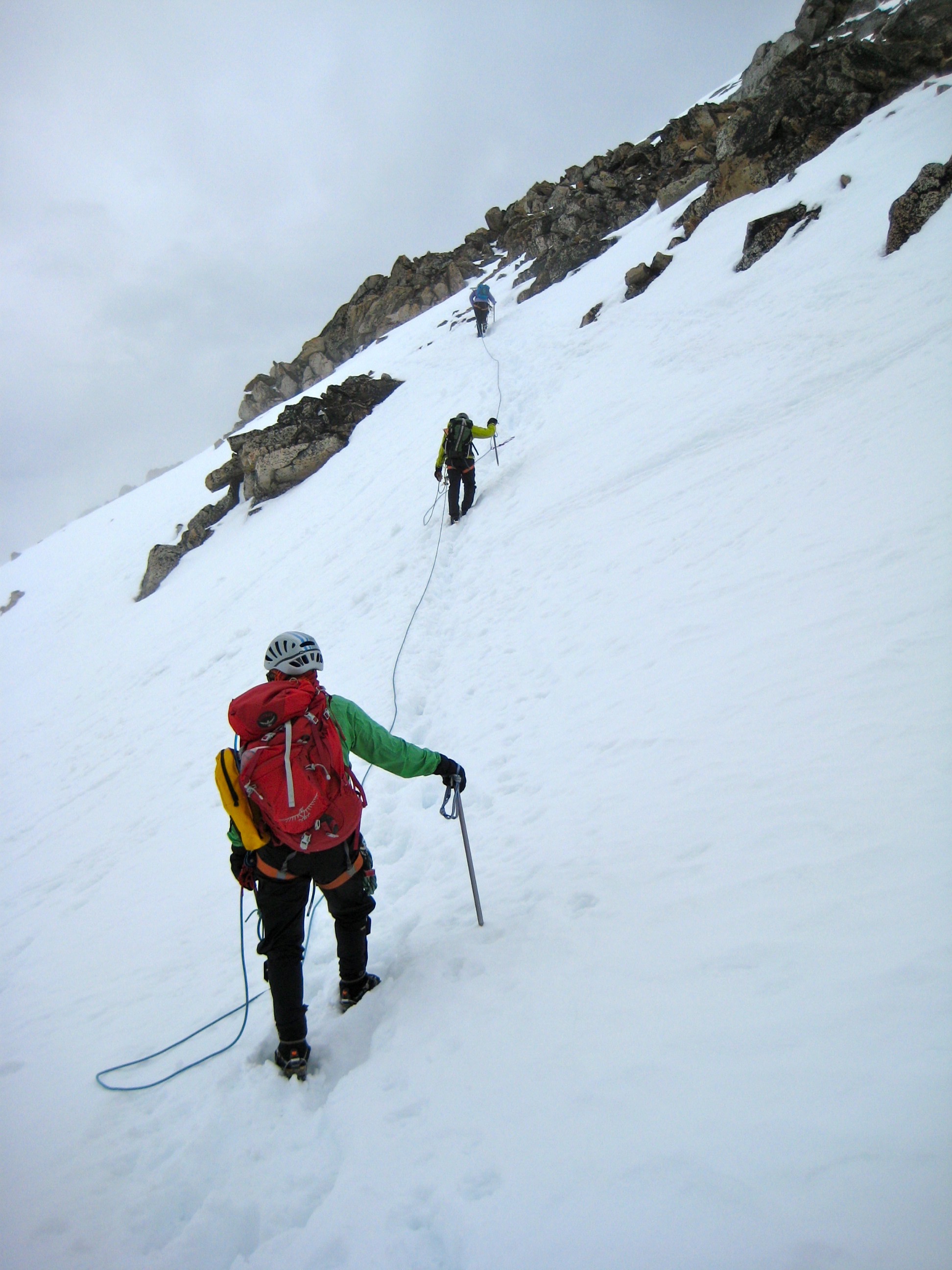 roped mountain climbers traversing snow field leading to the summit of Silver Star Mountain in the Mazama Mountains