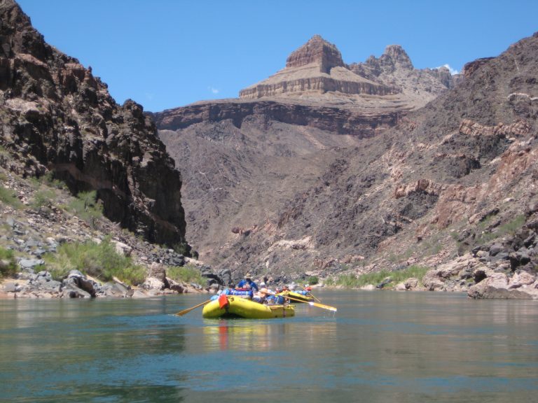 Oarboats float down the Colorado River in Grand Canyon National Park