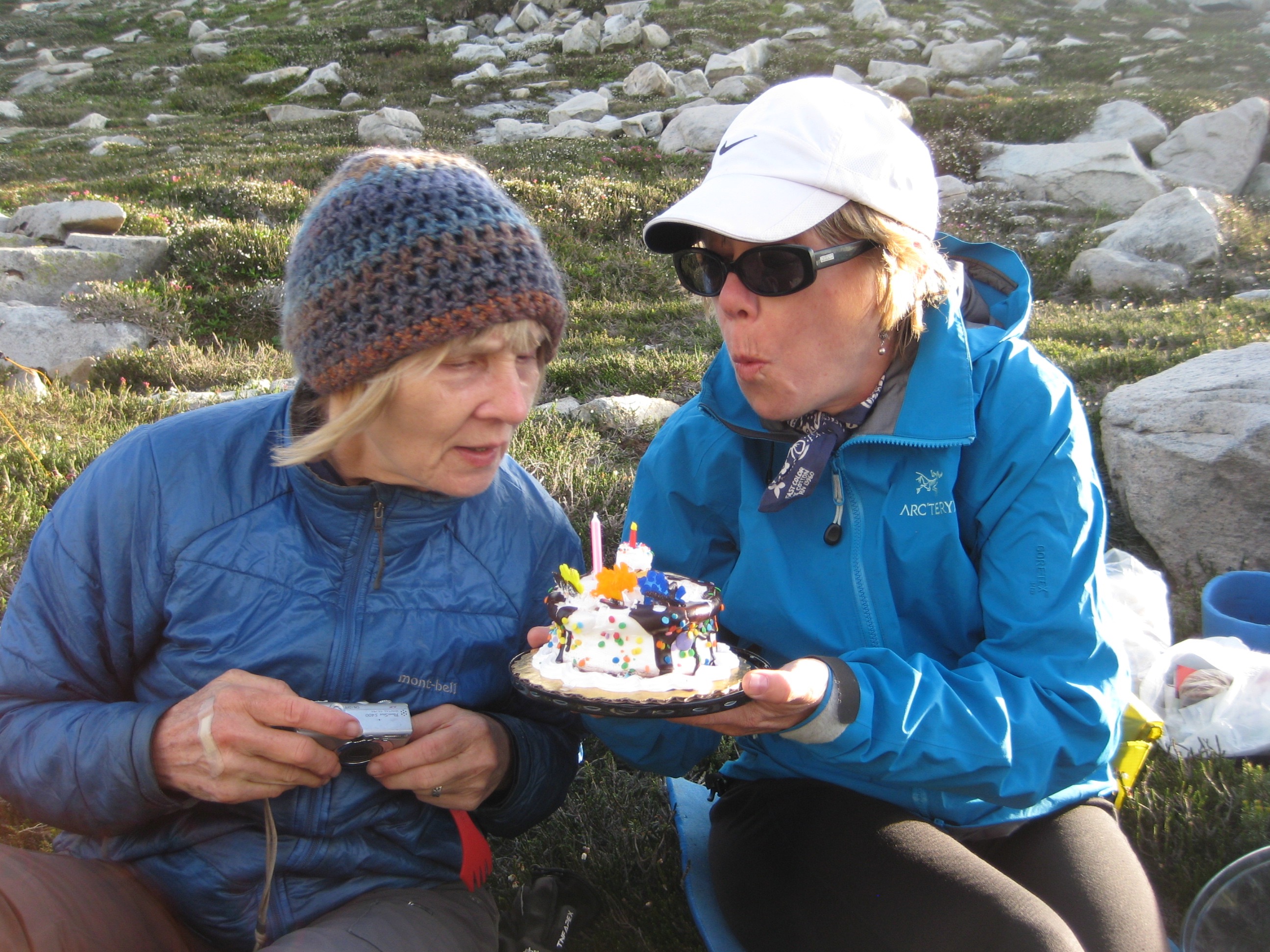 mountain climbers with a birthday cake