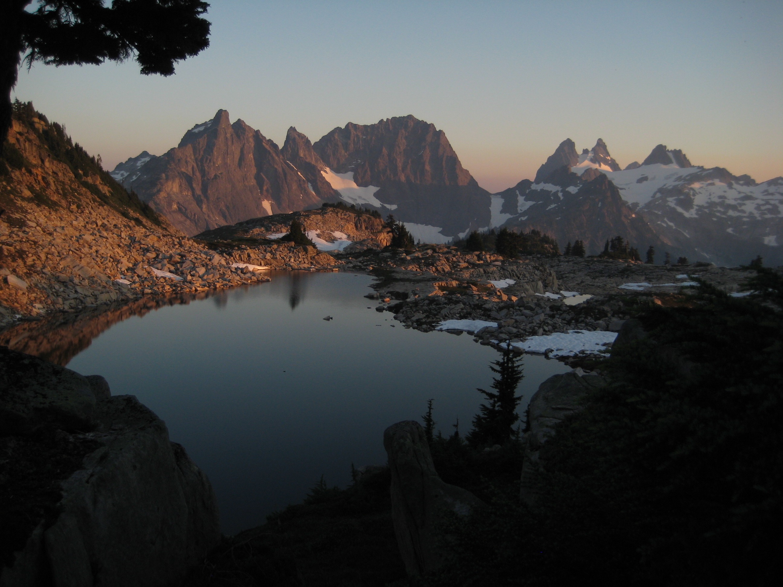 evening ligth on Little Big Chief Peak, Summit Chief Mountain, and Chimney Rock in the Snoqualmie Mountains with Tank Lakes in the Alpine Lakes WIlderness in the foreground
