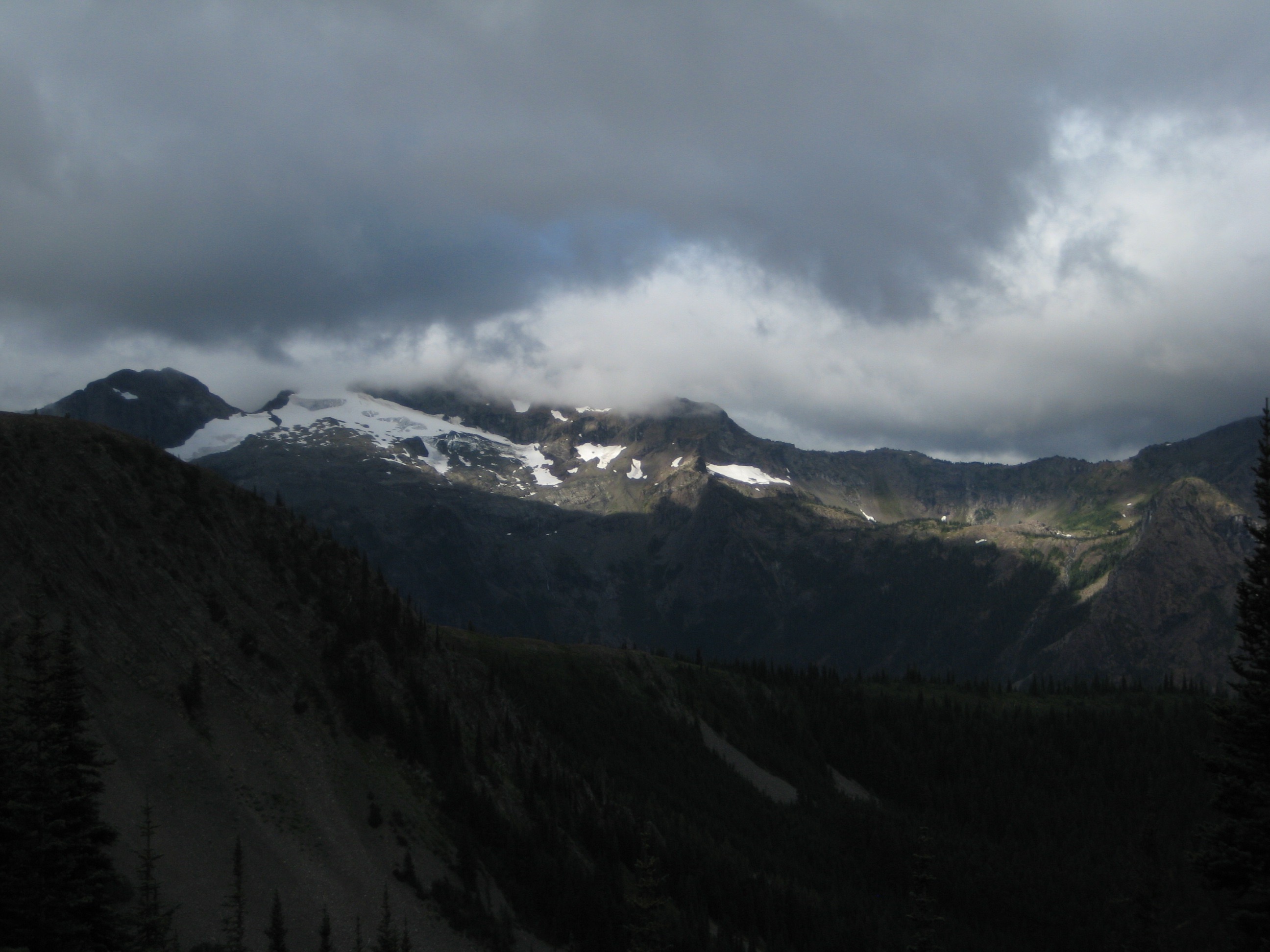 Sun On Jerry Glacier and Jerry Lakes in the Upper Skagit Mountains with a cloudy sky