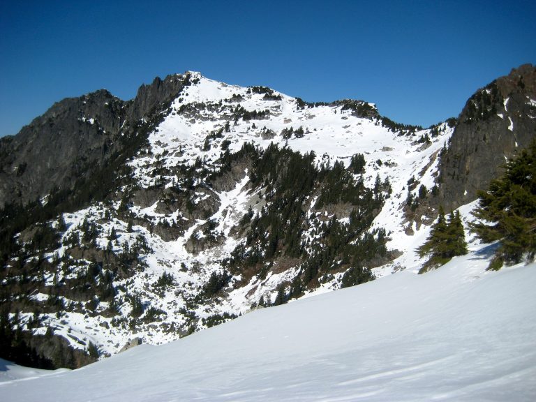 Looking across a valley at snowy Gunnshy Peak from Gunn Lake Saddle