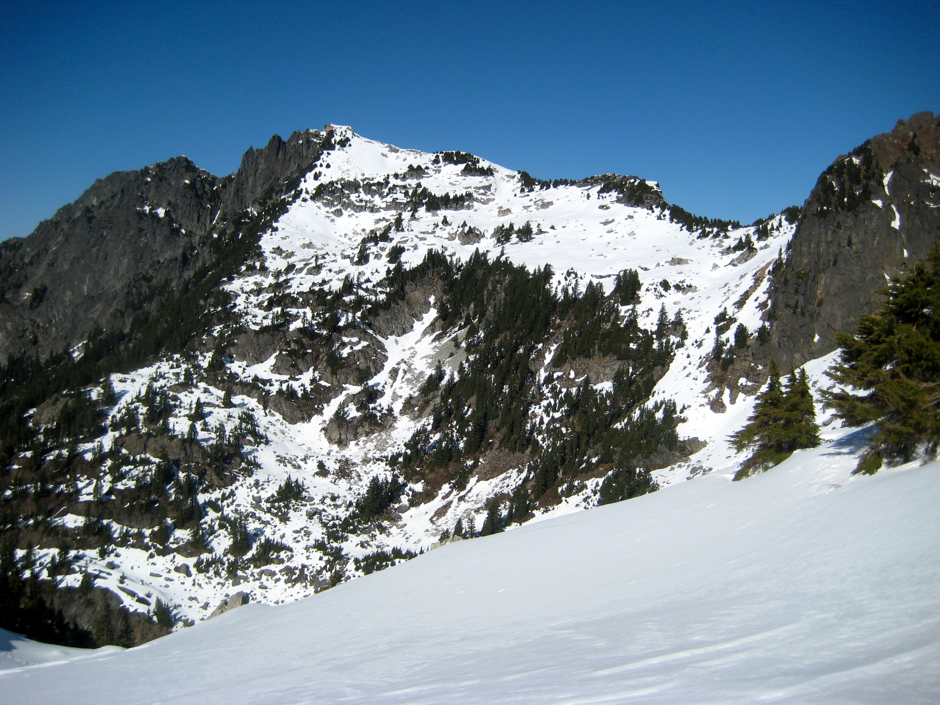 Looking across a valley at snowy Gunnshy Peak from Gunn Lake Saddle