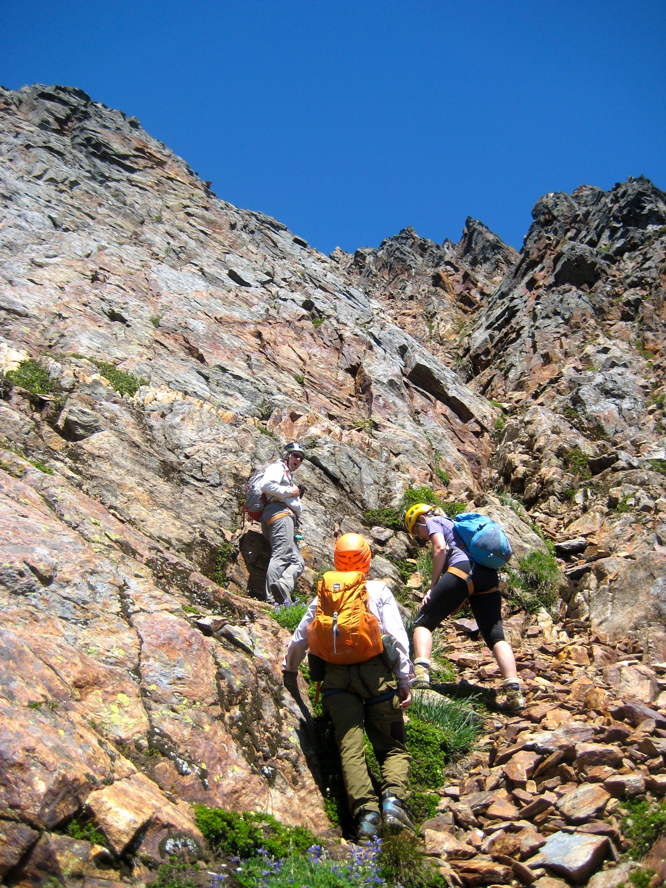 mountain climbers scrambling southwest gully on Mt Misch in the Glacier Peak Wilderness