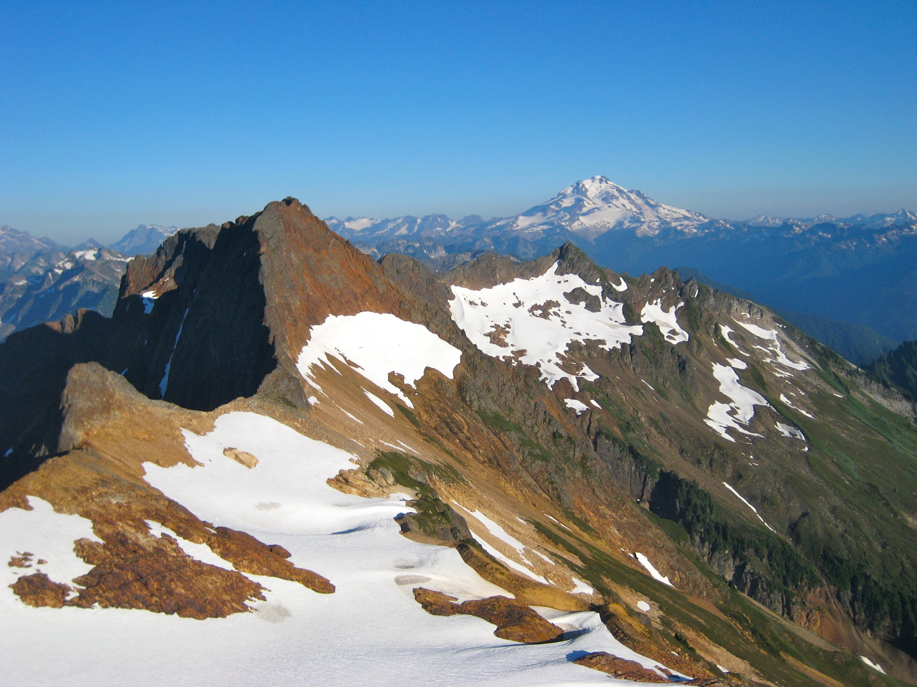 Mt Misch and Glacier Peak as seen from the summit of Mt Buckindy in the Glacier Peak Wilderness