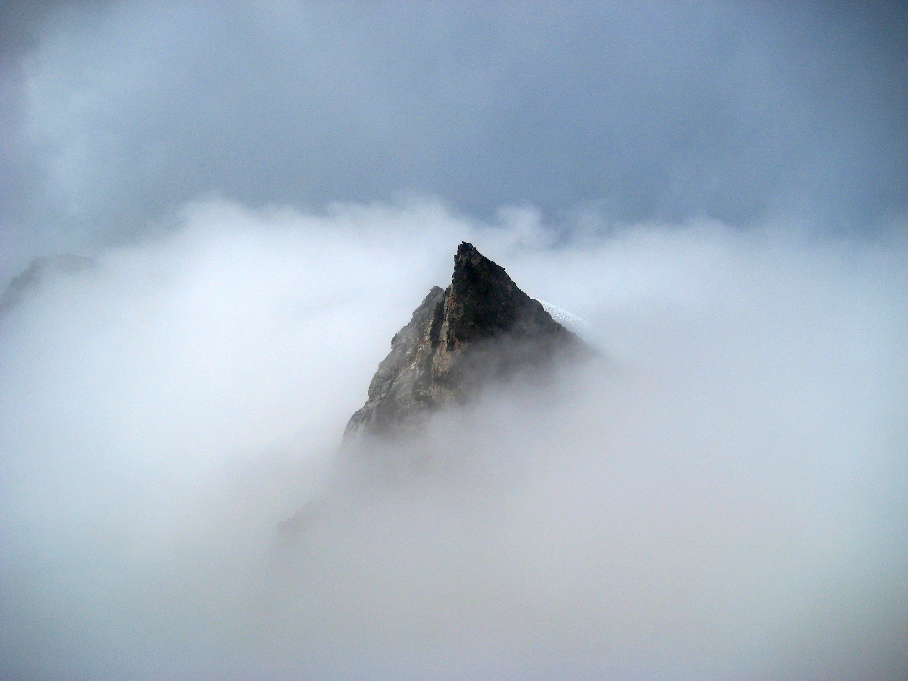 Mt Challenger Pinnacle sticking up out of the fog from the summit of Mt Challenger