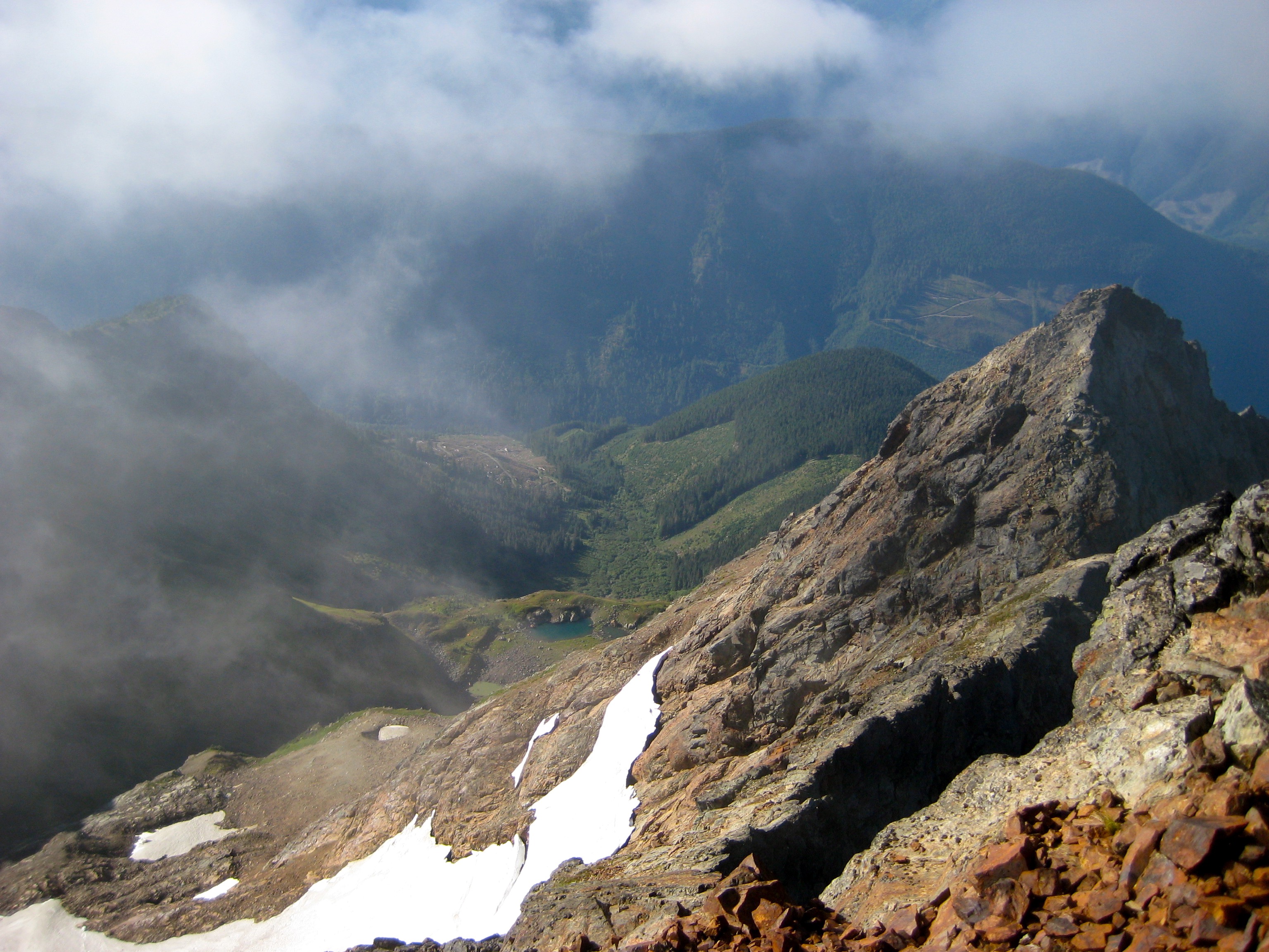 looking down the south ridge of Welch Peak in the Cheam Range with linguring snow patches