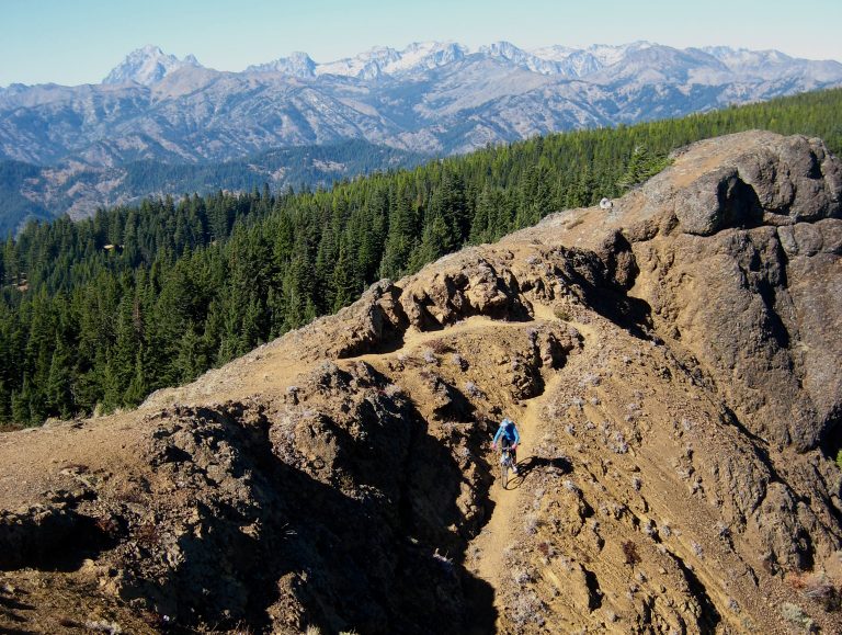 Eileen Biking Down Trail to the North From Red Top Lookout