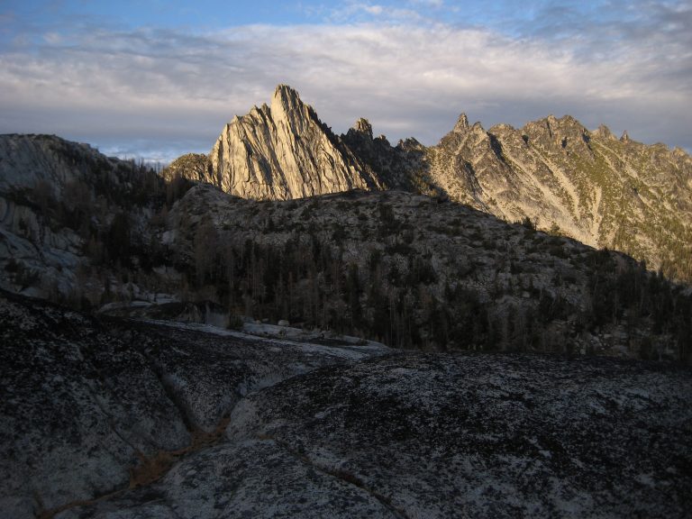 Evening sun lights up craggy granite Prusik Peak during Enchantment Traverse