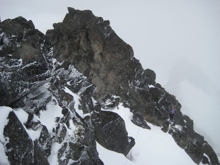 Mountain climbers ascend mixed snow and rock on Cashmere Mountain