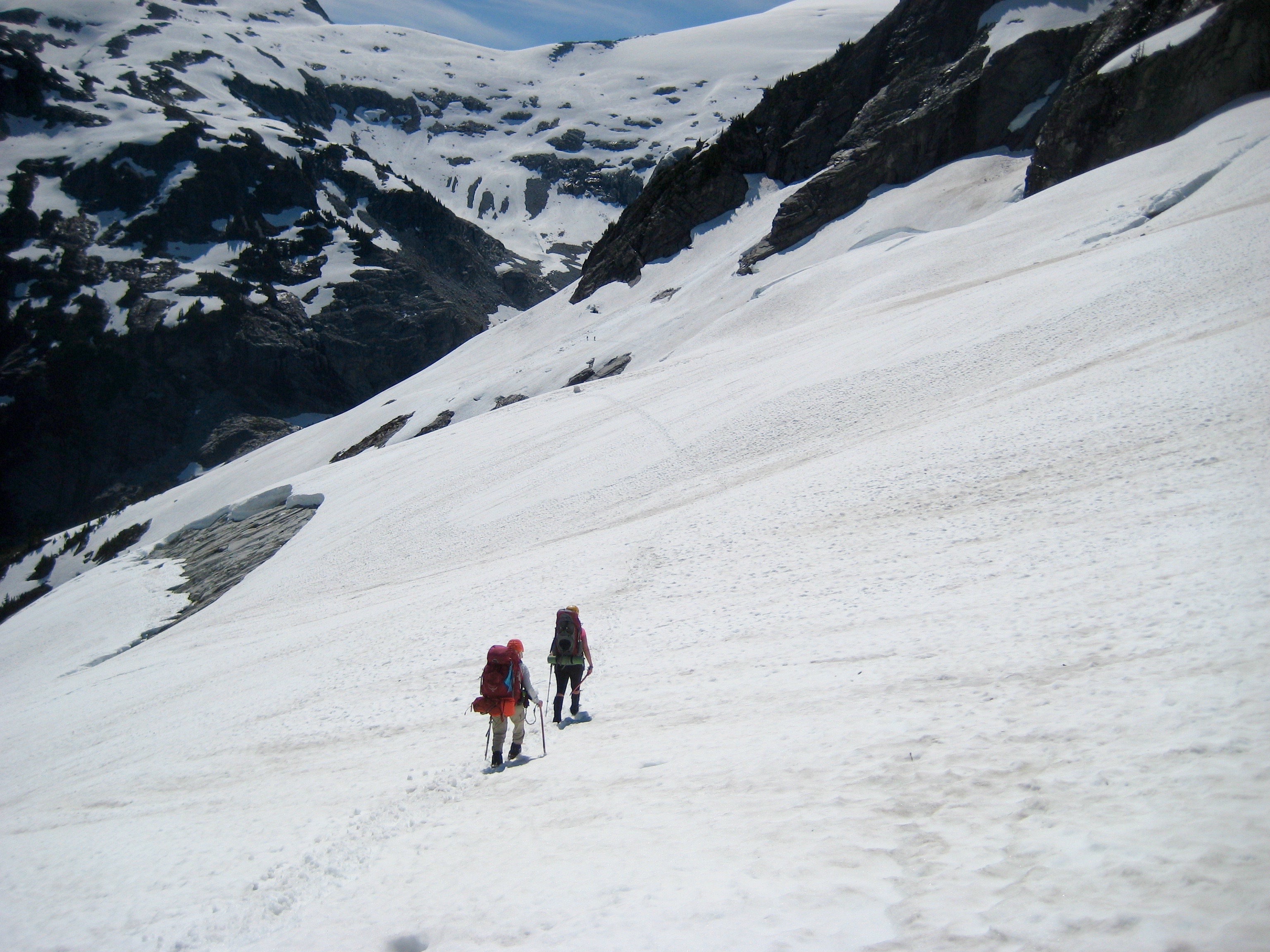 mountain climbers traversing snowy glacier under Whatcom Peak