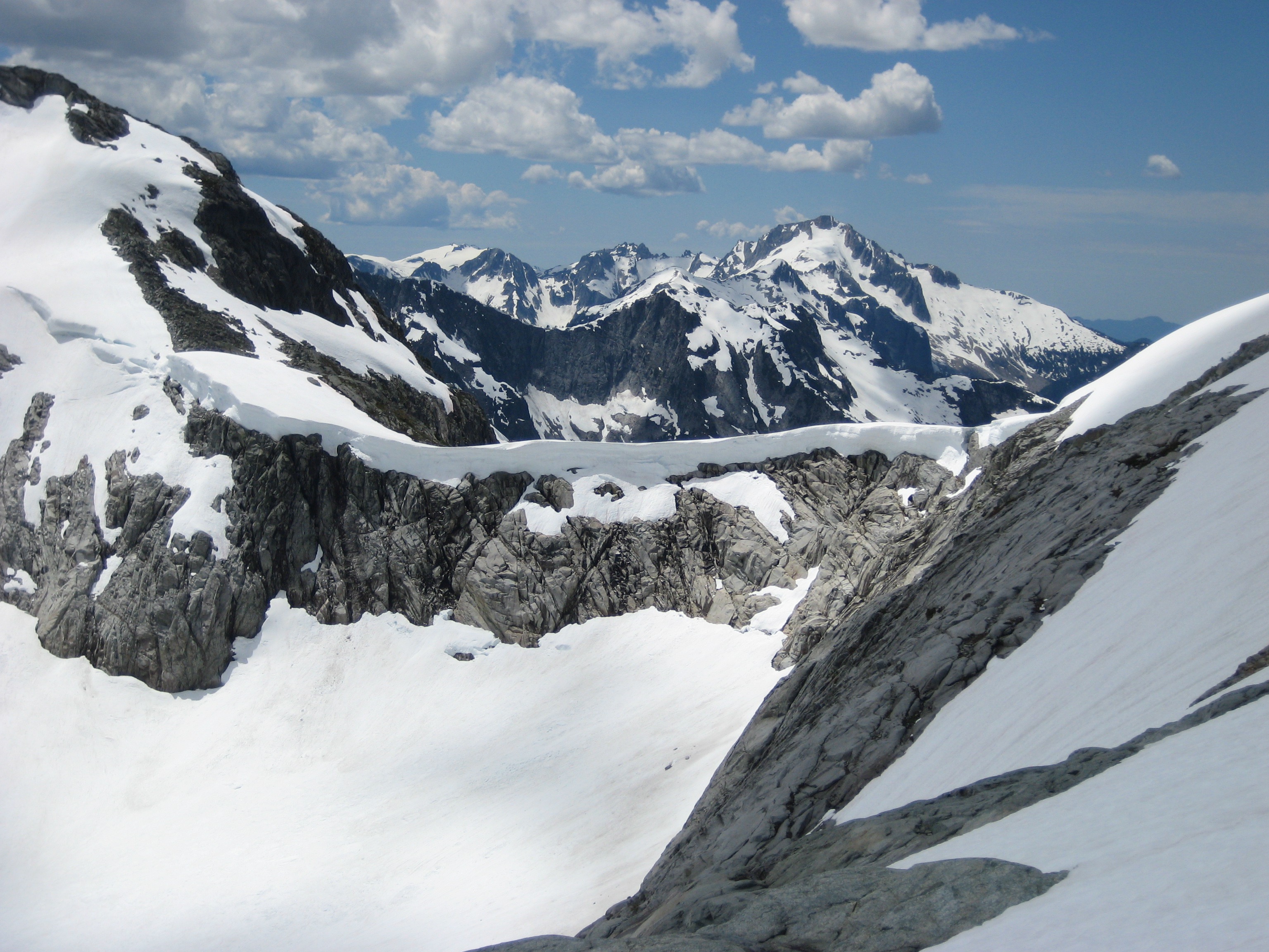 Perfect Pass in the Northern Picket Range with a full snowy cornice from the traverse route around Whatcom Peak