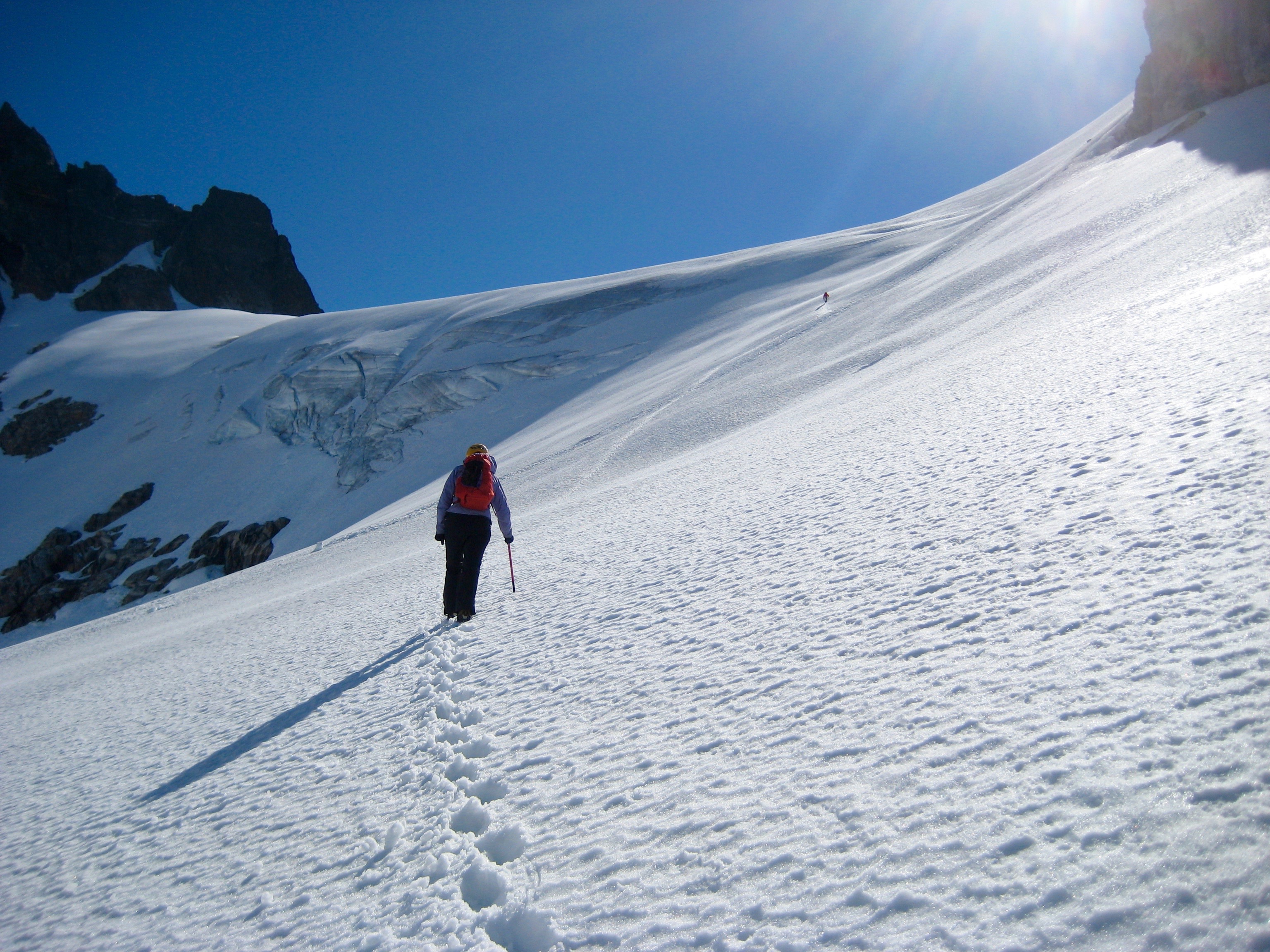 mountain climber booting up Crooked Thumb Glacier in the Northern Picket Range