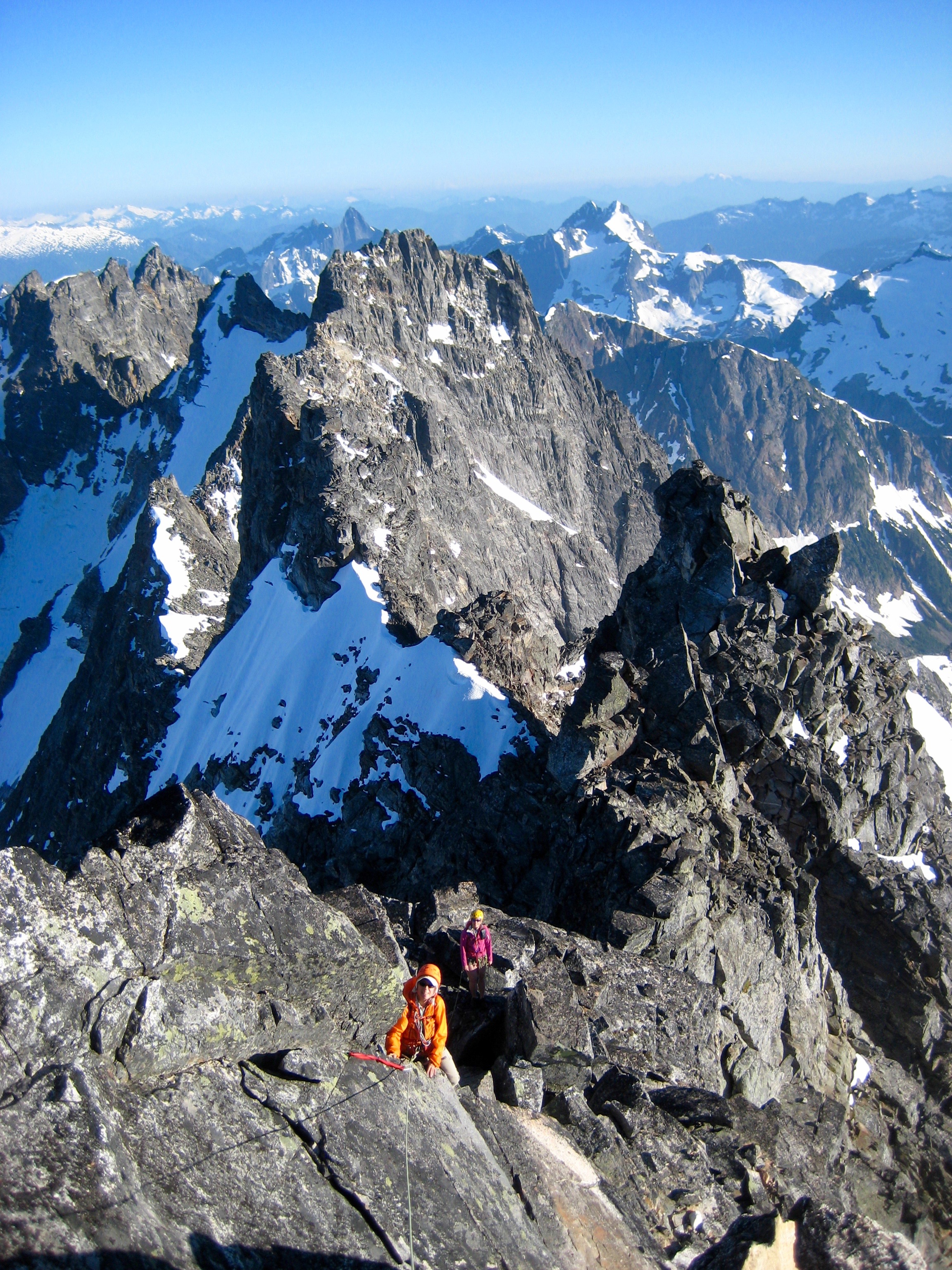 mountain climbers roped rock climbing the south summit ridge of Crooked Thumb Peak in the Northern Picket Range