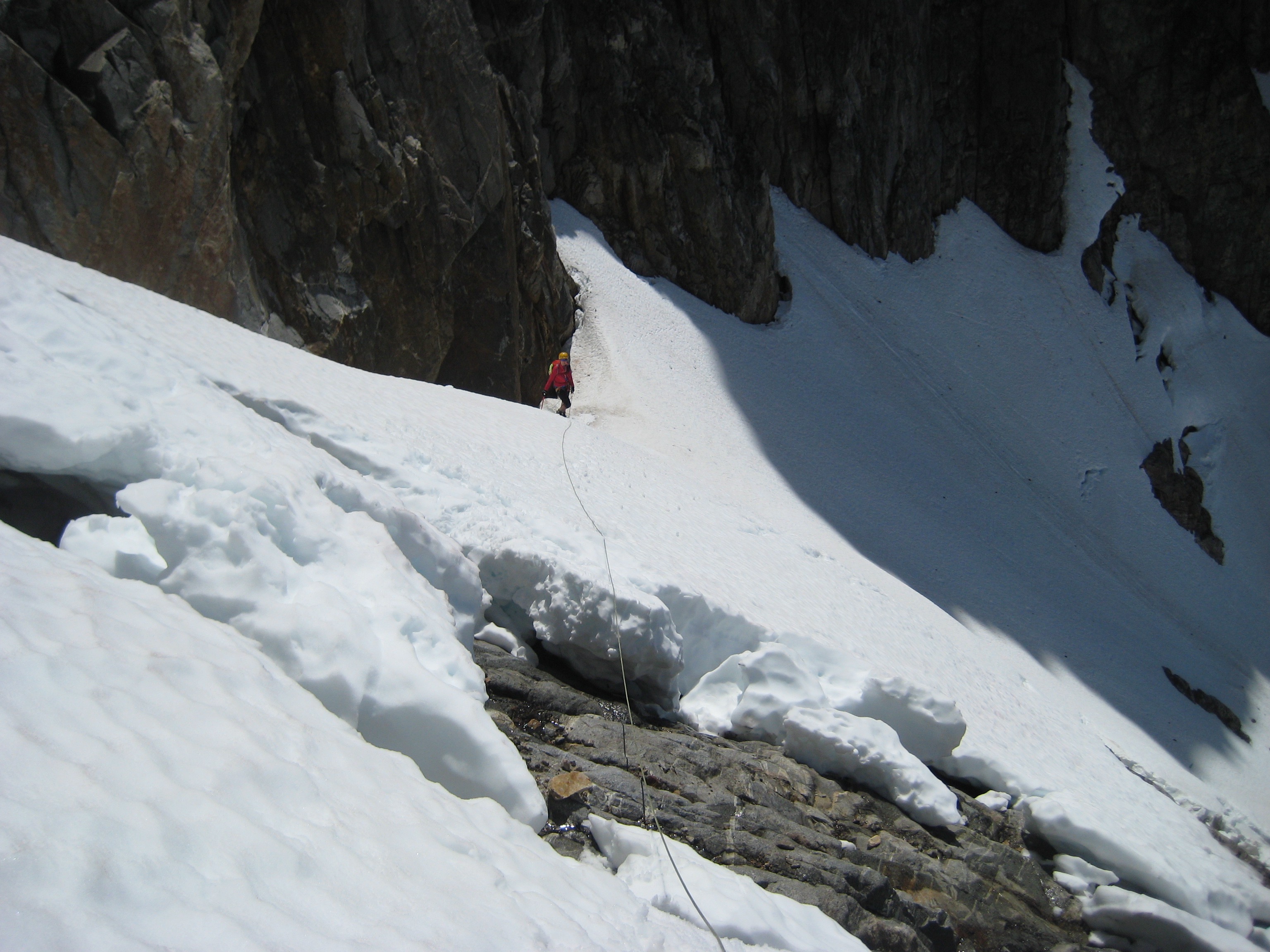 looking back over the bergschrund toward the mountain climber belay heading up Phantom Peak
