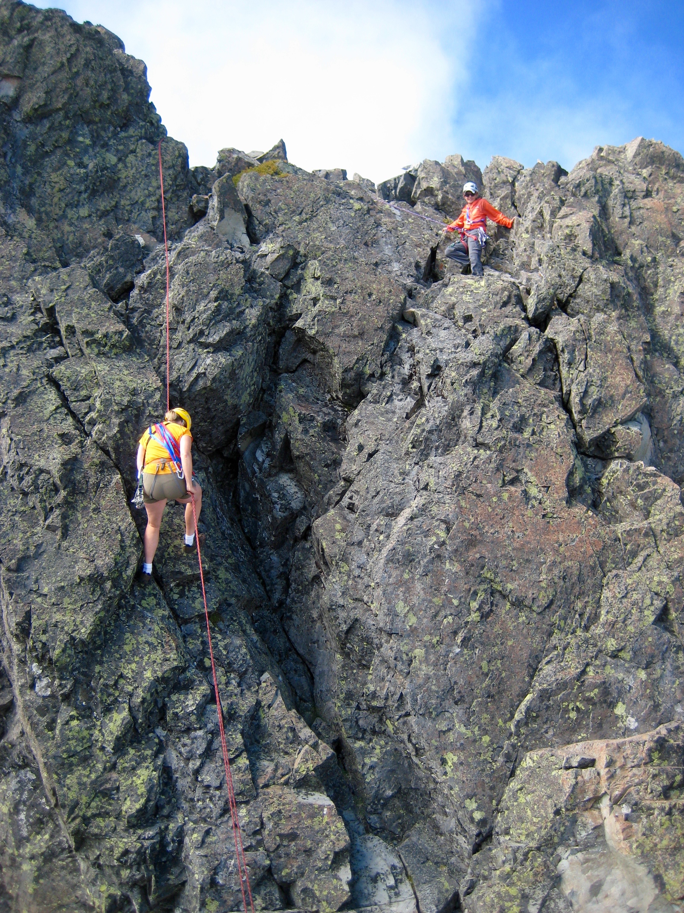 climbers on the broken rock, south face of Unicorn Peak Horn in the Tatoosh Range in Mt Rainier National Park 