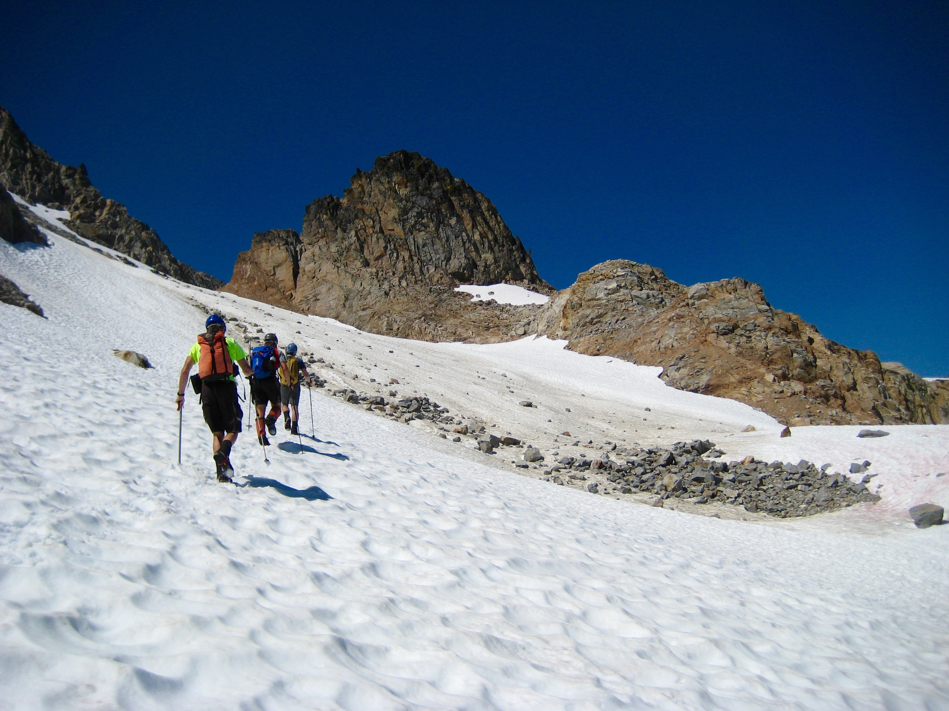 mountain climbers traversing the East Sandalee Glacier heading to McGregor Mountain in the North Cascades