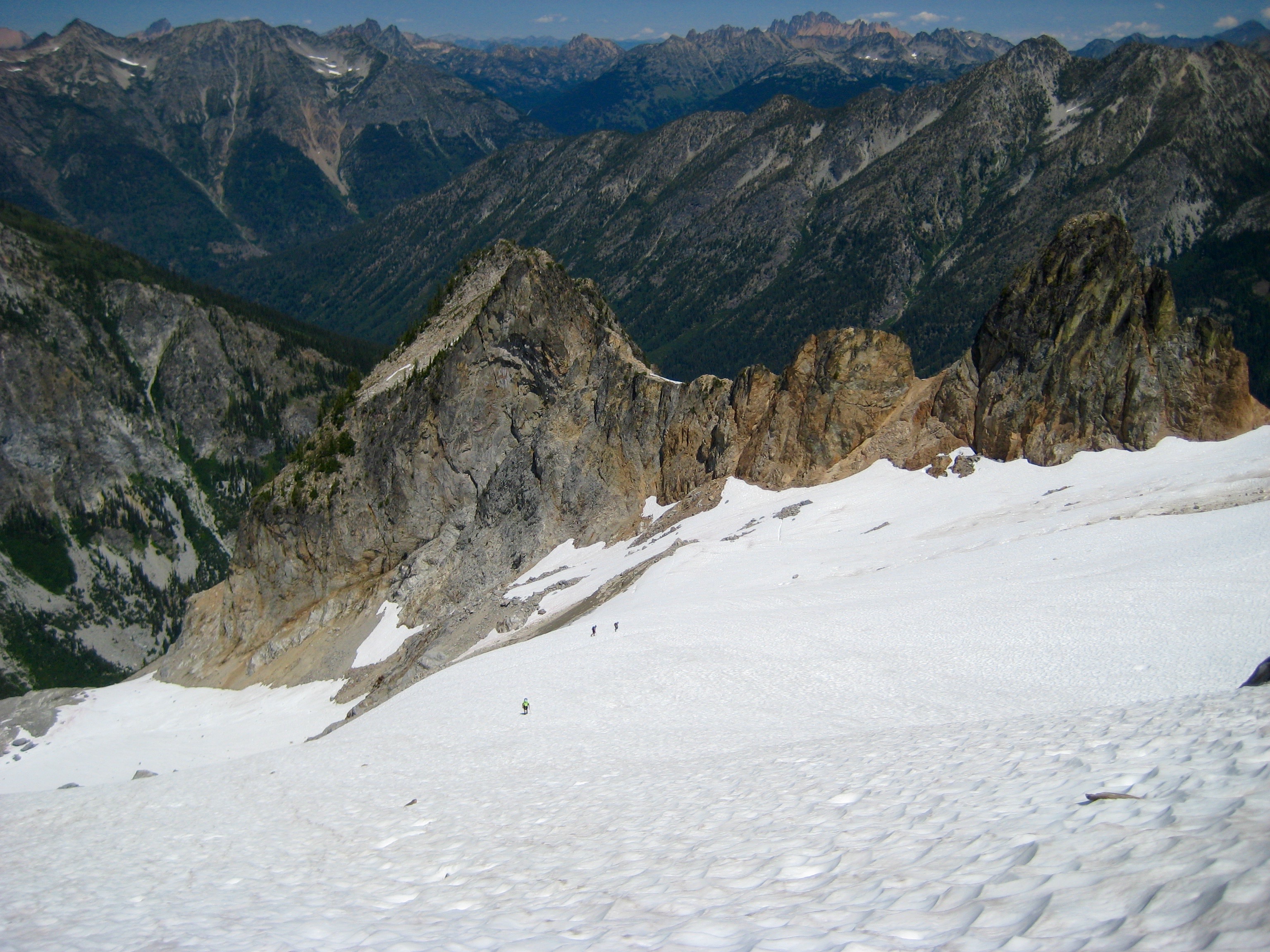 looking down on mountain climbers ascending Middle Sandalee Glacier on McGregor Mountain in the Stehekin Mountains in the North Cascades