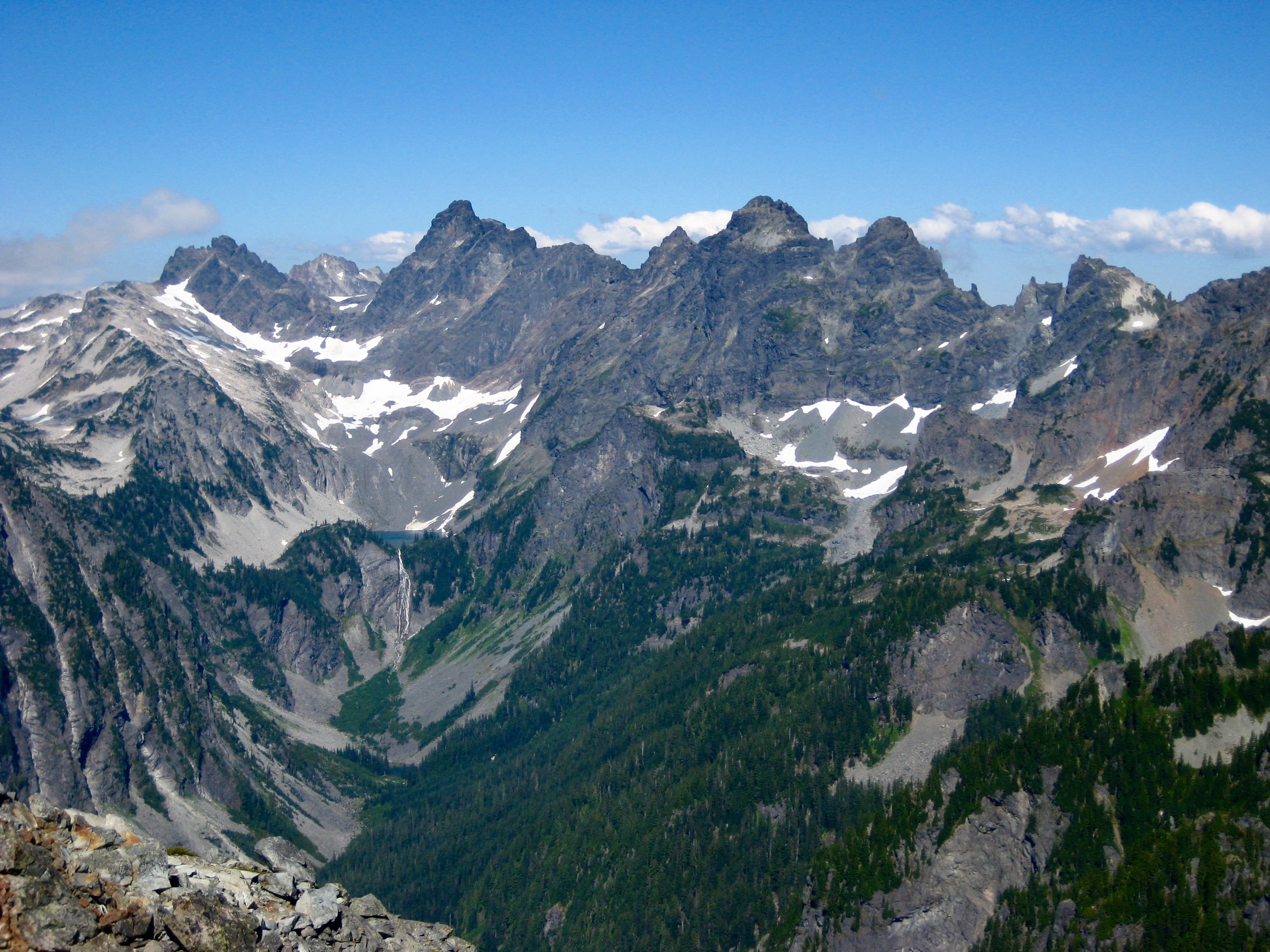 Overcoat Peak, Chimney Rock, and Lemah Mountain as seen from the summit of Mt Thomson in the Snoqualmie Mountains